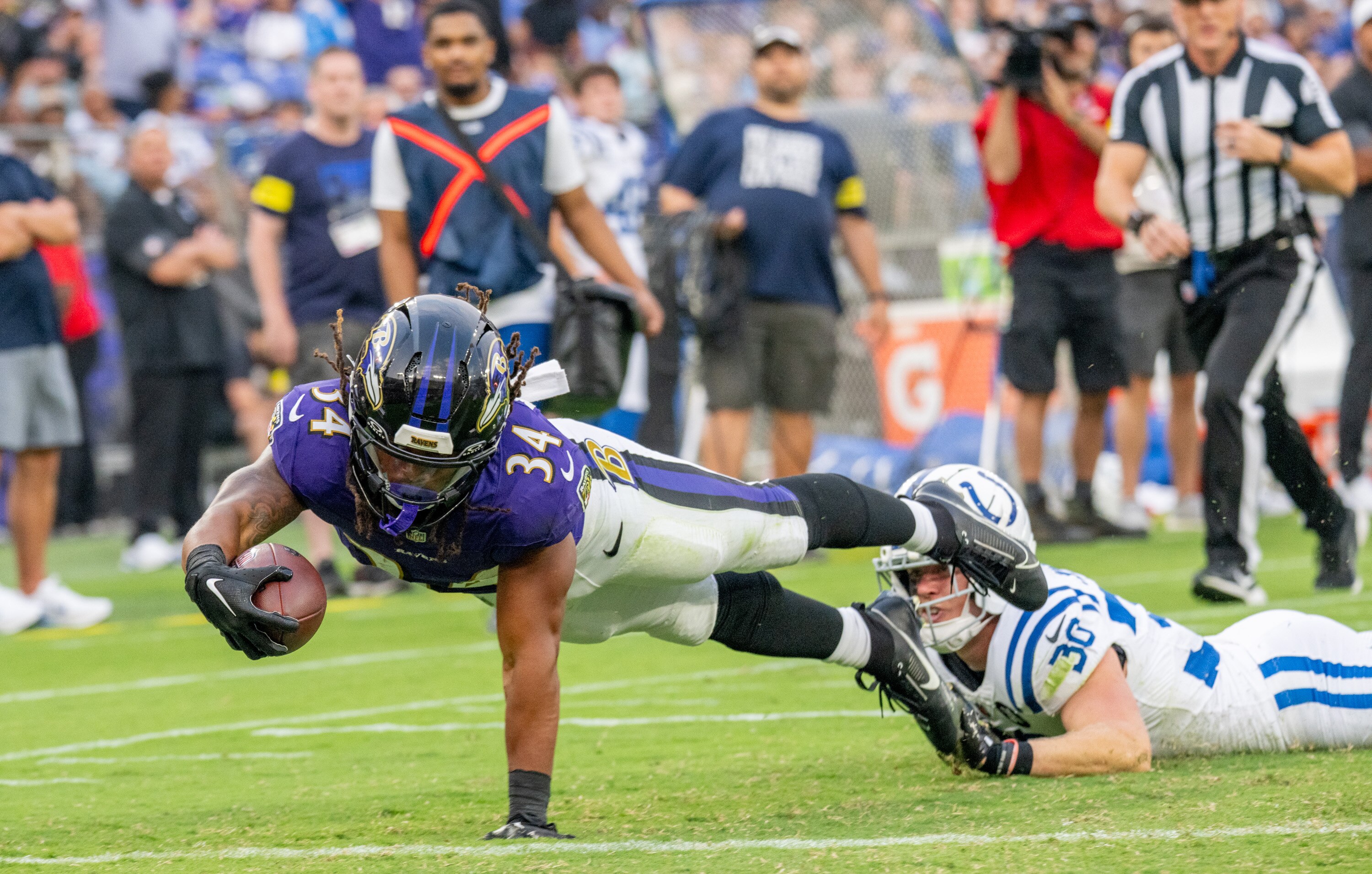 Ravens running back Keaton Mitchell dives for a touchdown in the first quarter against the Indianapolis Colts on Thursday night. 
