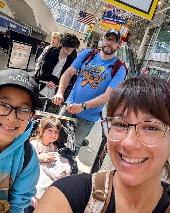 Jessica Carr and her family waiting in line Thursday as they depart for their spring break trip