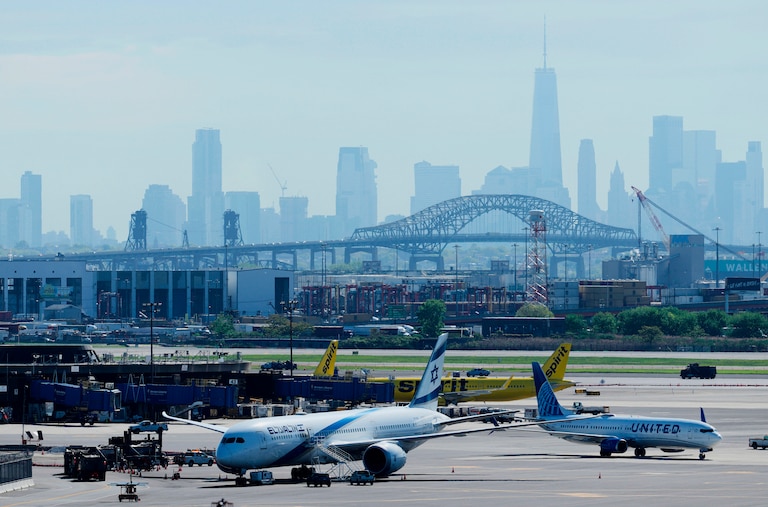 The New York City skyline is seen behind Newark Liberty International Airport in Newark, N.J., Wednesday, May 7, 2025.
