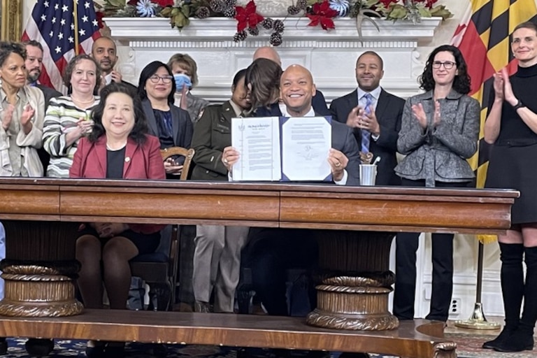 Maryland officials applaud as Gov. Wes Moore presents an executive order he signed Monday in the Maryland State House outlining the state's exploratory approach to artificial intelligence technologies.
