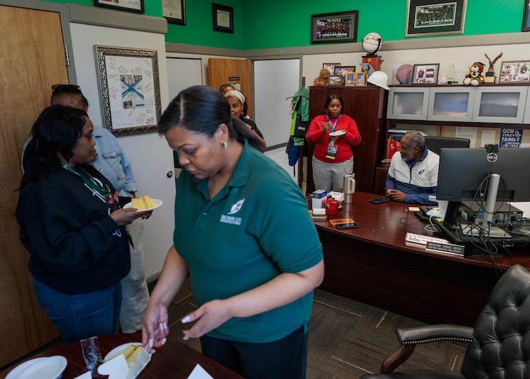 Friday, April 10, 2026, in Baltimore — Tamara Speaks cuts up homemade cakes Baltimore City Recreation and Parks Director Reginald Moore’s brought to share with his staff at his office at Druid Hill Park.