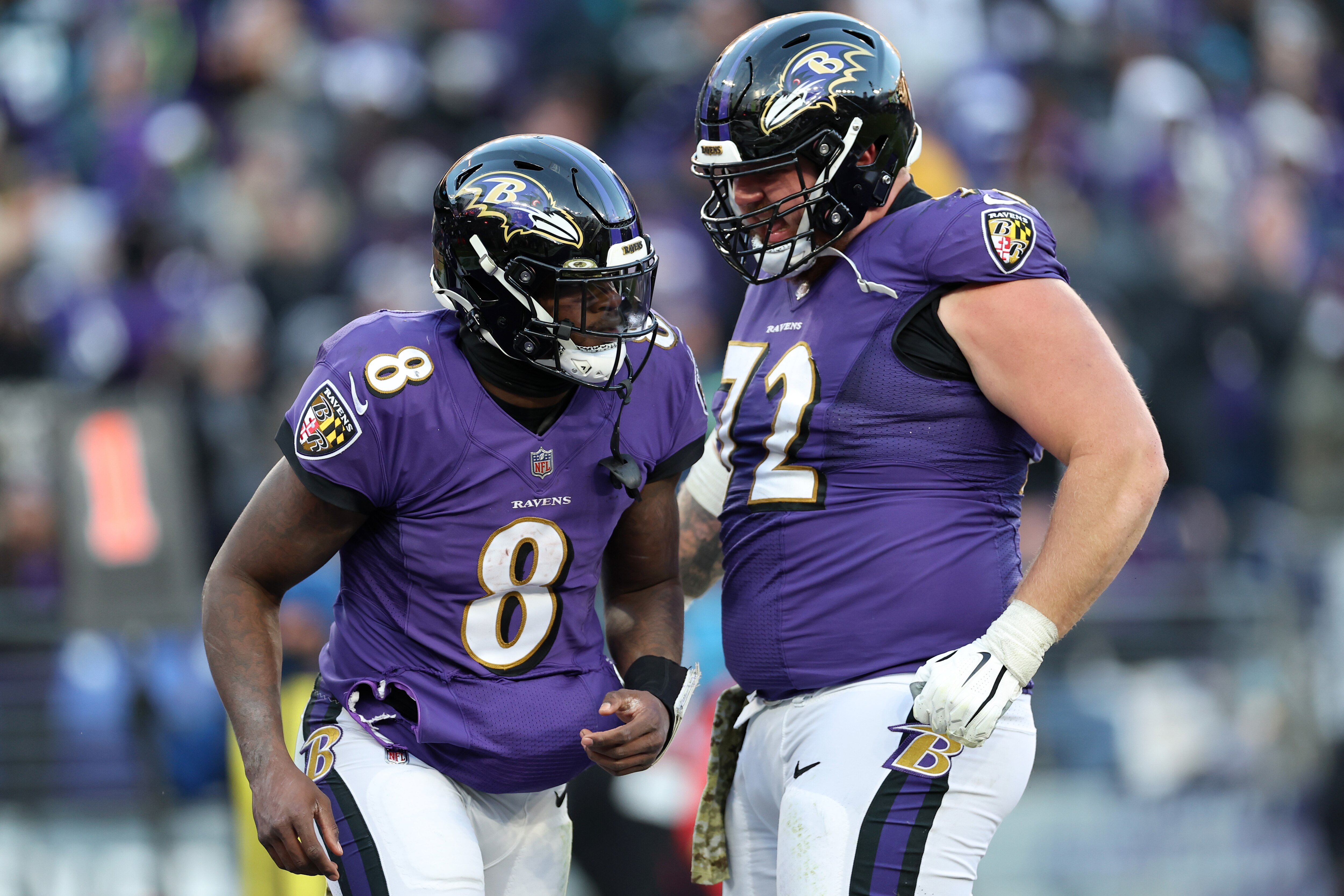 BALTIMORE, MARYLAND - NOVEMBER 20: Lamar Jackson #8 celebrates with Ben Powers #72 of the Baltimore Ravens after scoring a touchdown in the fourth quarter of a game against the Carolina Panthers at M&T Bank Stadium on November 20, 2022 in Baltimore, Maryland.