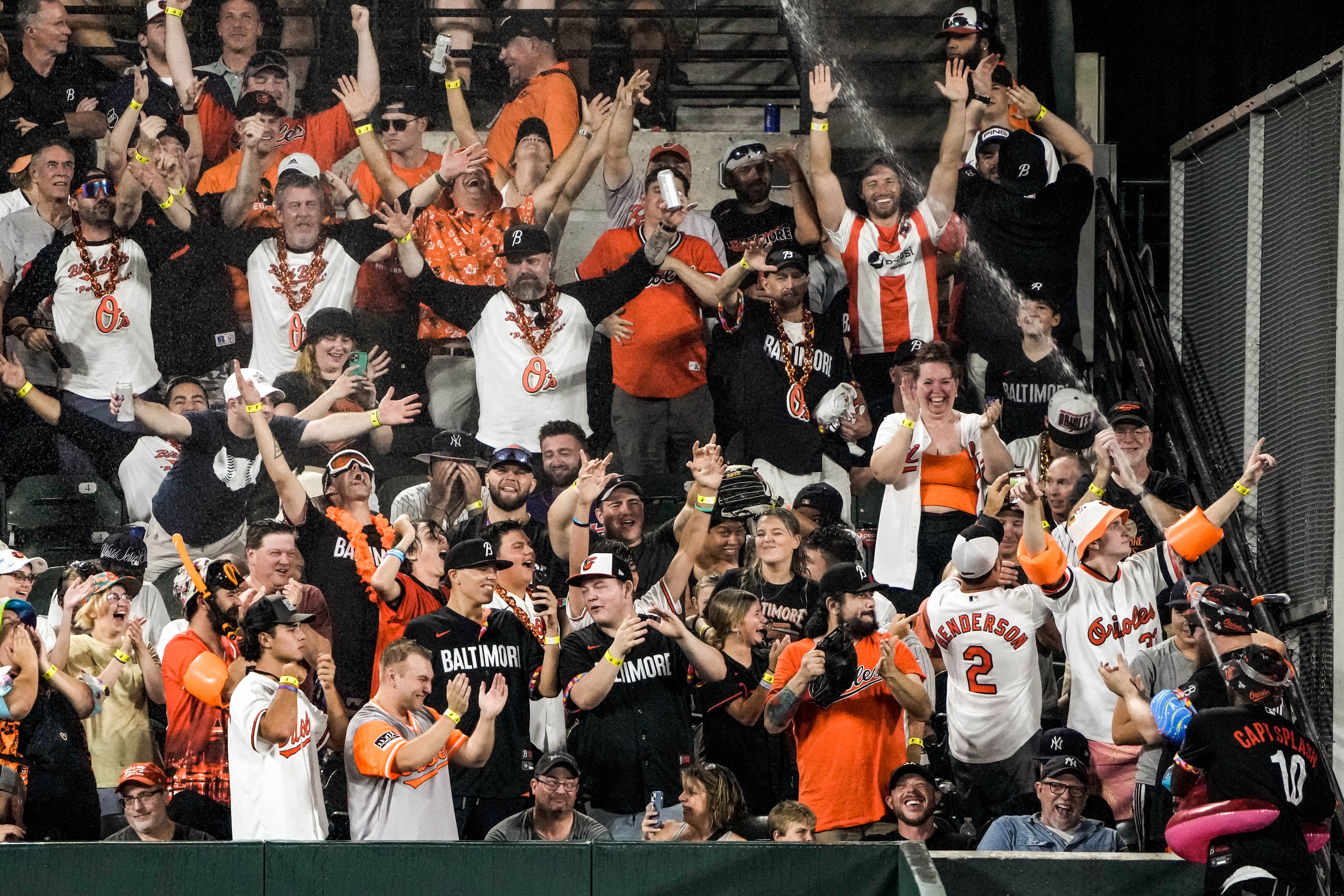 Former Orioles outfielder Adam Jones sprays the crowd during the first game of their series against the Yankees on Friday night at Camden Yards.