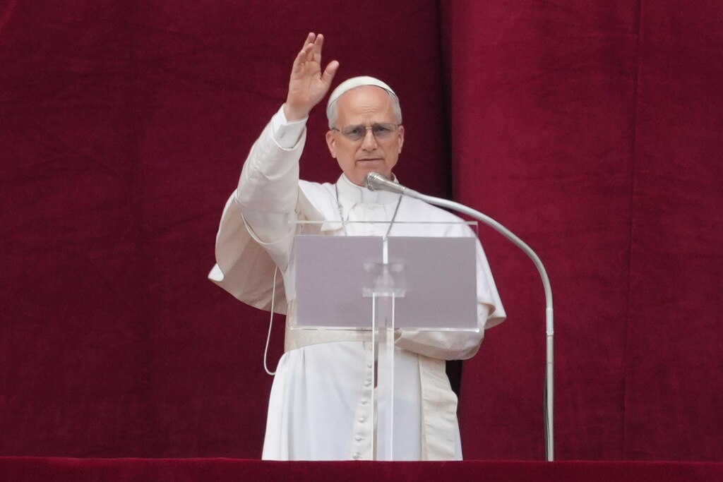 Pope Leo XIV delivers his blessing from the central balcony of St. Peter's Basilica for his first Sunday blessing after his election.