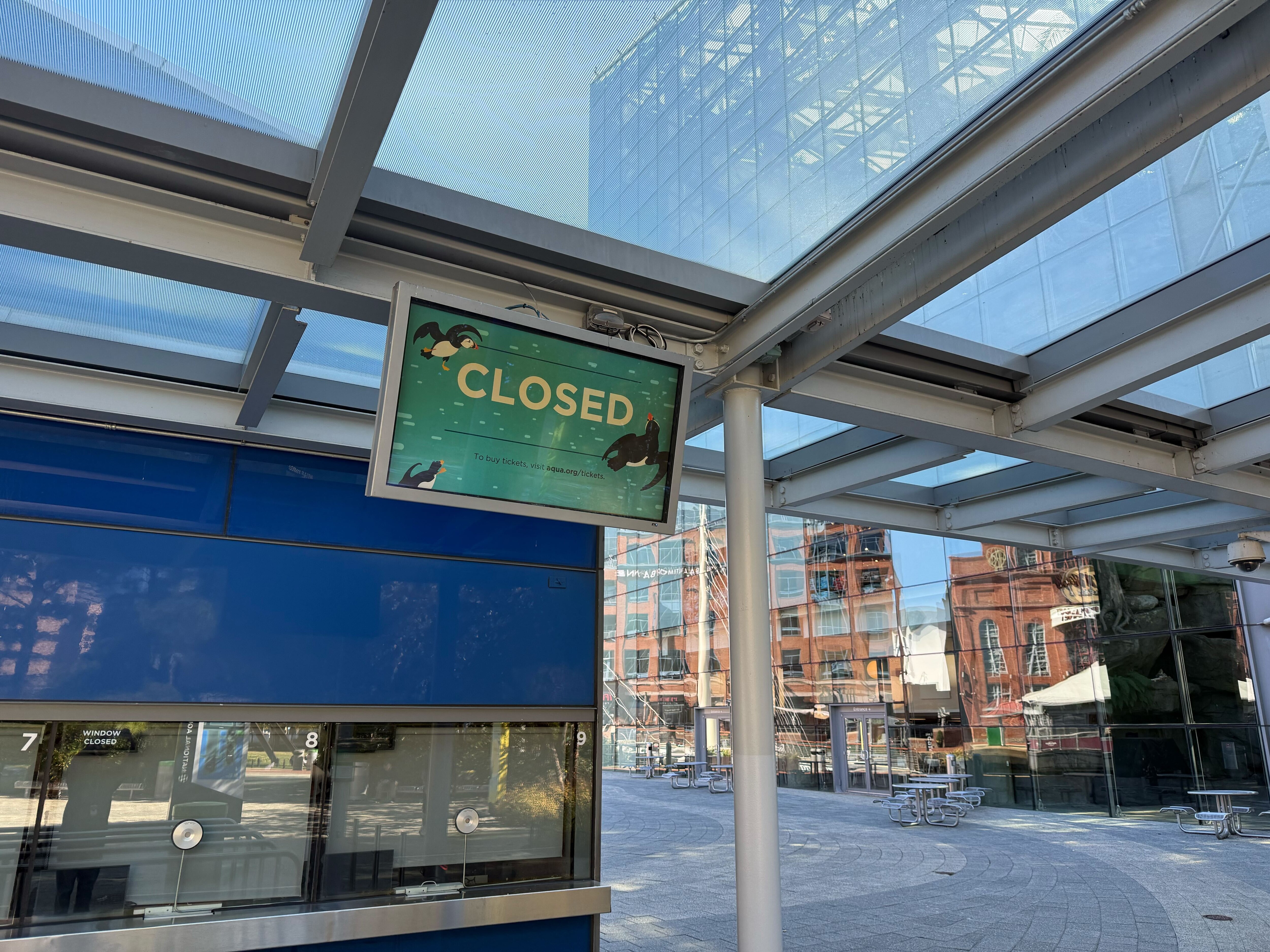 A sign outside the National Aquarium in Baltimore on Thursday, Oct. 16, 2025, tells visitors it was closed.