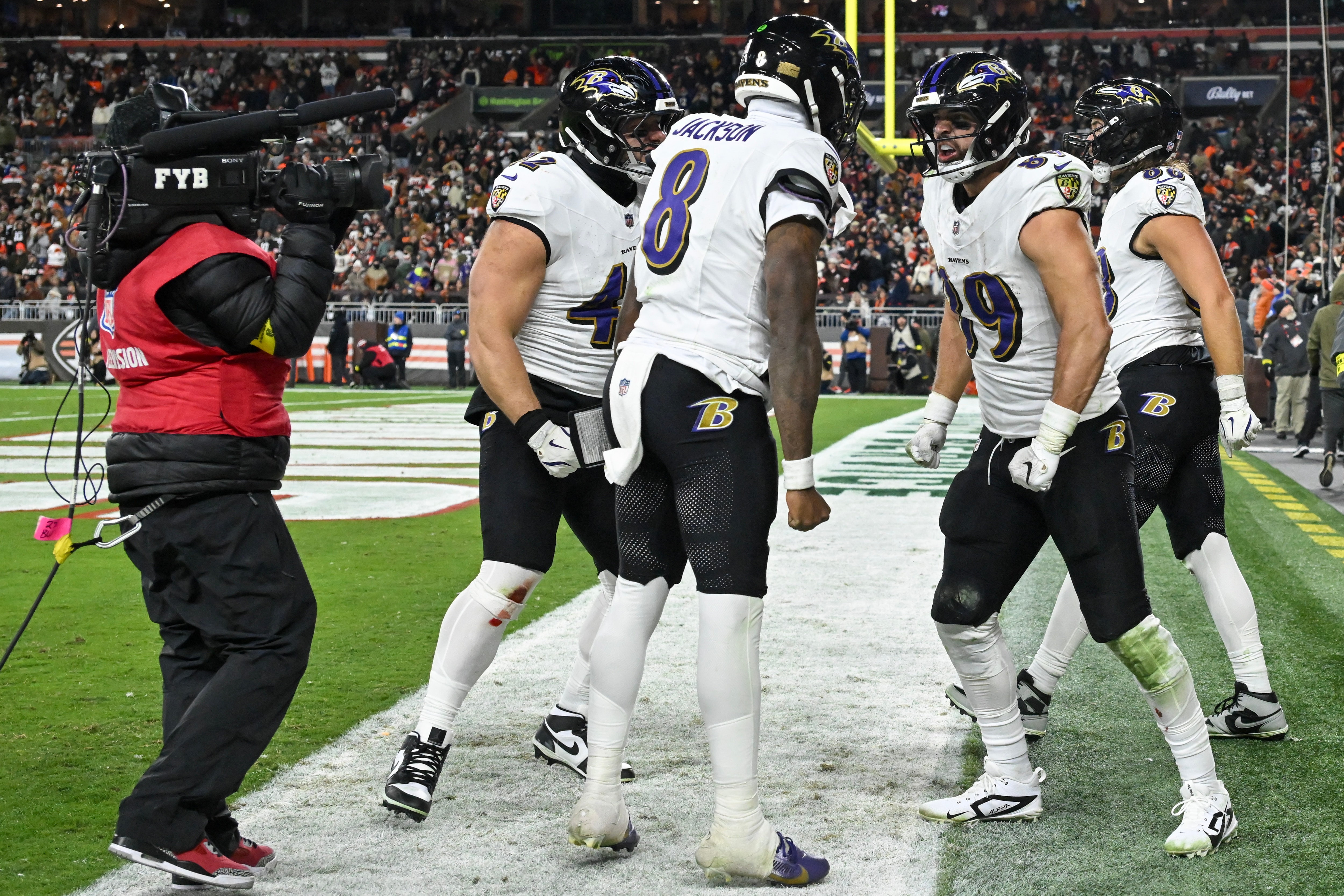 Ravens tight end Mark Andrews celebrates his game-winning rushing touchdown with Lamar Jackson. 