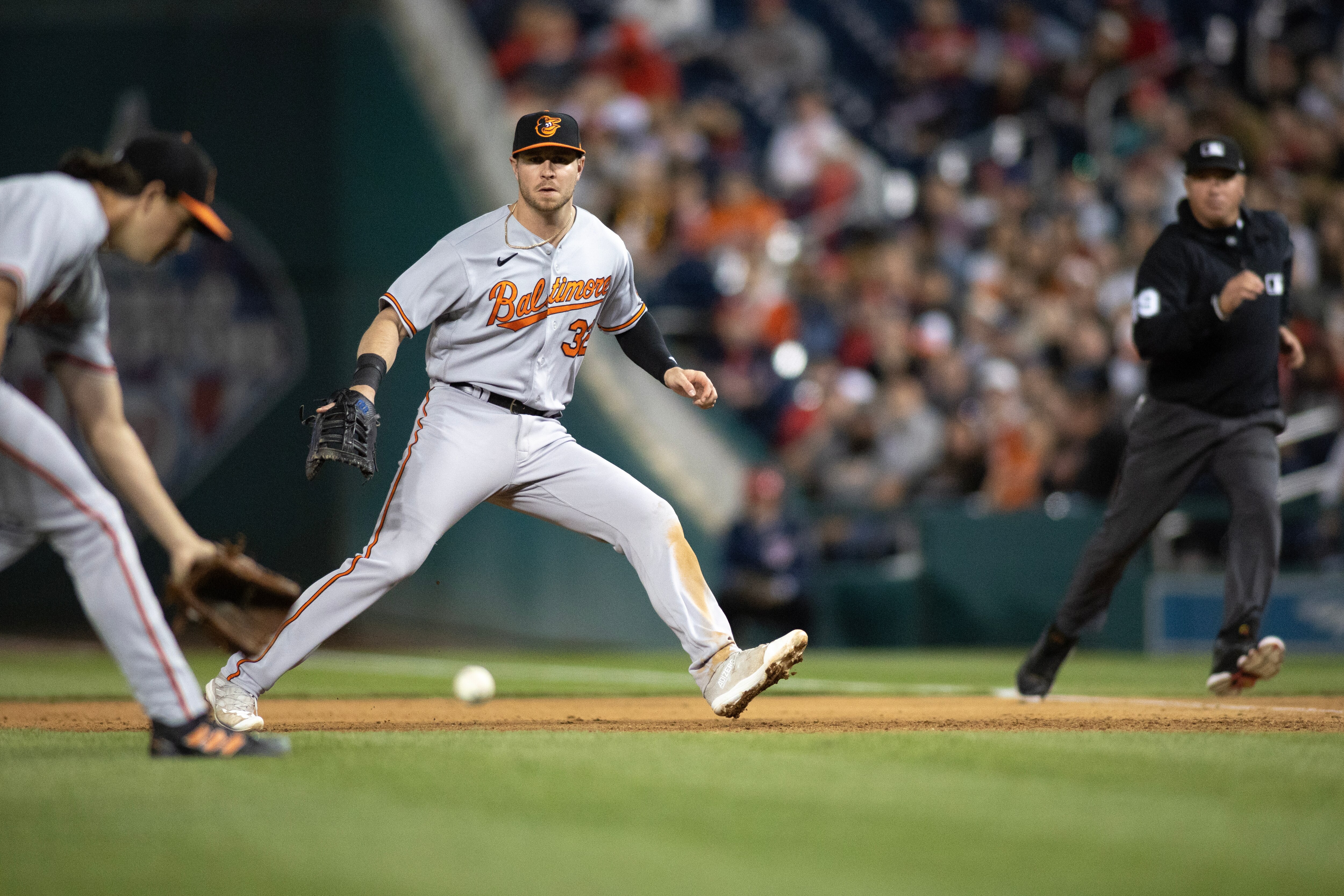 Baltimore Orioles first baseman Ryan O'Hearn (32) reacts after attempting to field a ground ball, during a regular season game between the Baltimore Orioles and Washington Nationals at Nationals Park in Washington, D.C., on Tuesday, April 18, 2023. Baltimore defeated the Nationals 1-0. (Tom Brenner for The Baltimore Banner)