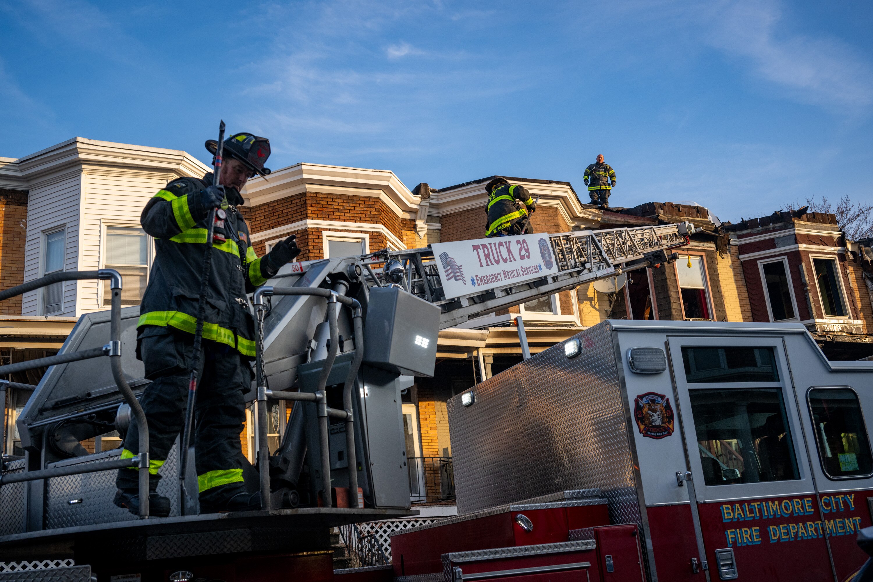 Baltimore City firefighters mop up following a three-alarm fire where one person died early Friday on 38th Street in the Waverly neighborhood.