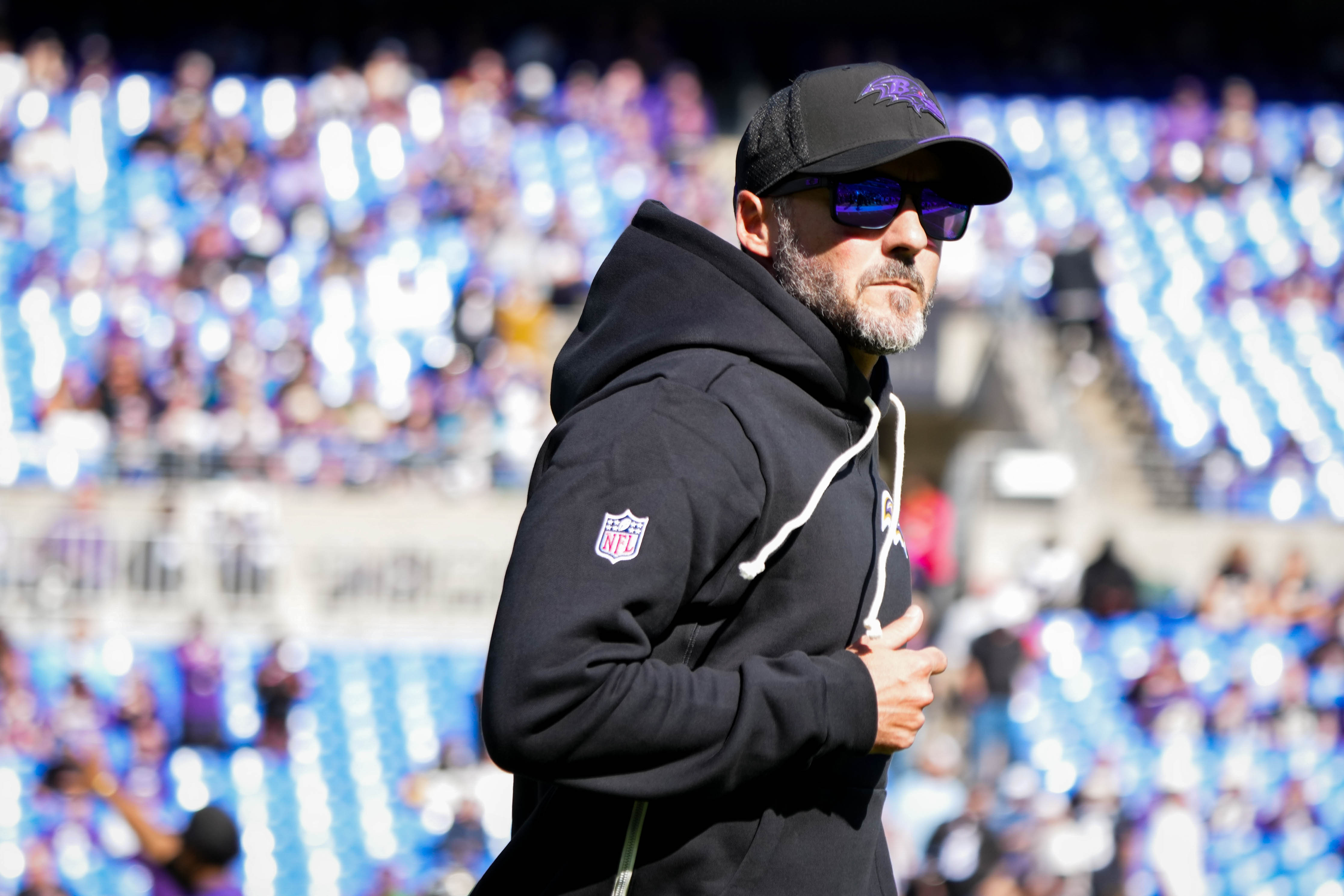 Ravens head coach Jesse Minter runs on the field ahead of Sunday’s regular season game against the Cincinnati Bengals at M&T Bank Stadium.