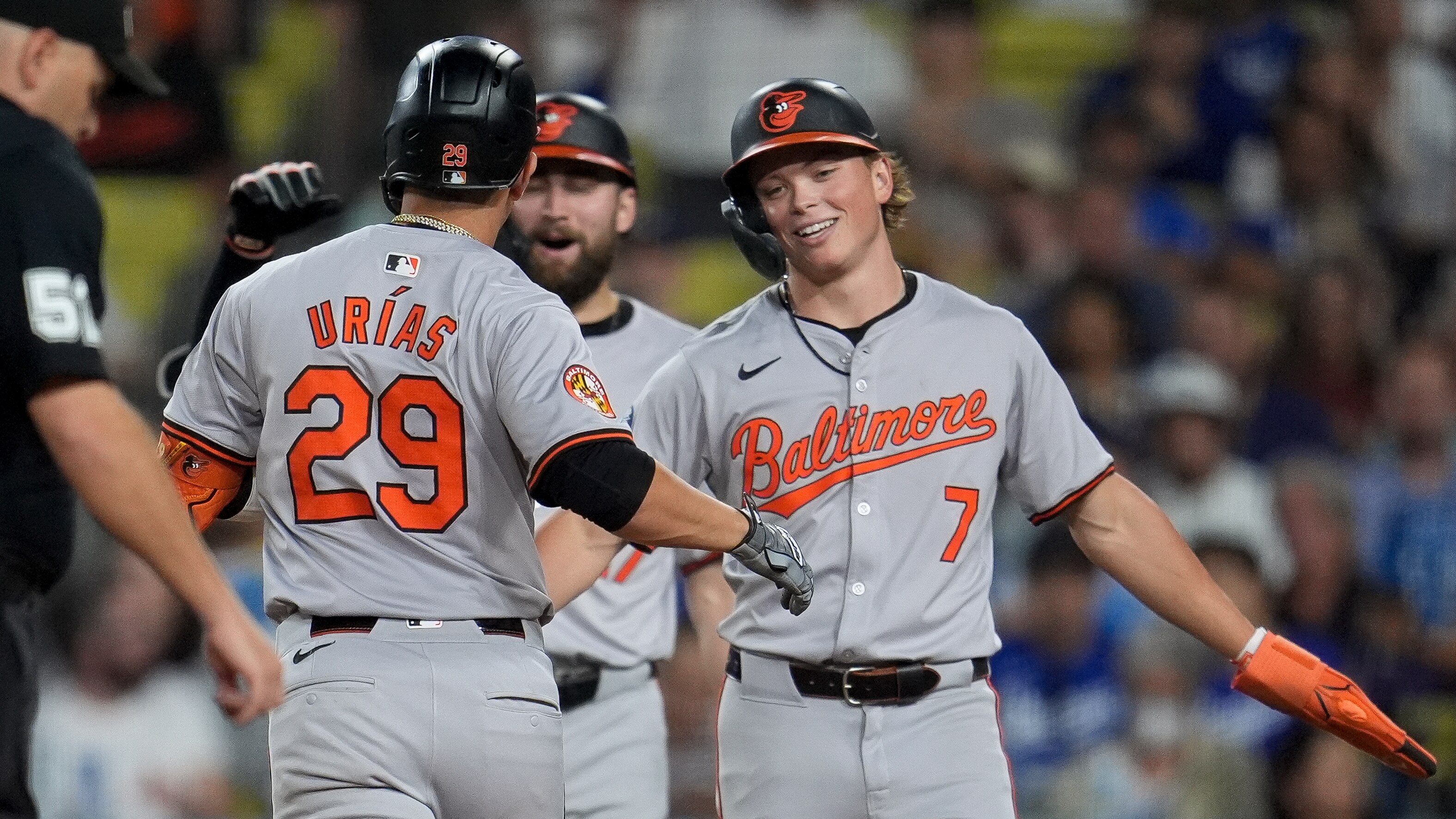 Baltimore Orioles' Ramón Urías (29) celebrates his two-run home run with Jackson Holliday (7) during the fifth inning of a baseball game against the Los Angeles Dodgers, Tuesday, Aug. 27, 2024, in Los Angeles. (AP Photo/Marcio Jose Sanchez)
