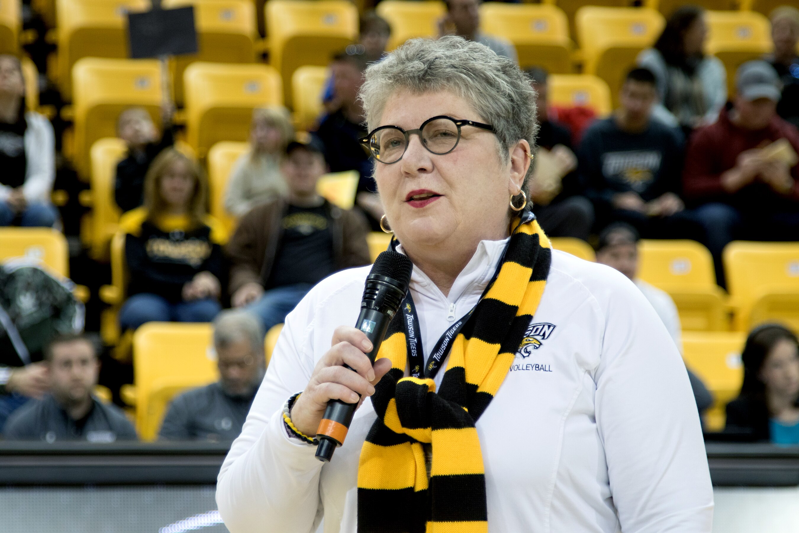 Kim Schatzel, then-president at Towson University, speaks to the crowd after signing a memorandum of understanding between the Maryland National Guard and Towson University during the pre-game ceremony at Towson University’s military appreciation men’s basketball game at Towson, Maryland, Jan. 27, 2018. The memorandum affirms the partnership between the Maryland National Guard and Towson University. It also provides new opportunities to both Maryland National Guard service members and Towson University students in areas like cyber security.