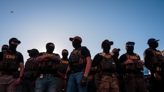 NEWARK, NEW JERSEY - MAY 28: ICE agents stand guard outside of the federal immigration center at Delaney Hall, where ICE is housing detained immigrants, on May 28, 2026 in Newark, New Jersey. The ongoing protests, which became tense over the holiday weekend, come amid reports of a hunger strike by detainees.