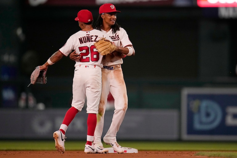 WASHINGTON, DC - MAY 19: Nasim Nuñez #26 and CJ Abrams #5 of the Washington Nationals celebrate after they defeated the New York Mets at Nationals Park on May 19, 2026 in Washington, D.C.