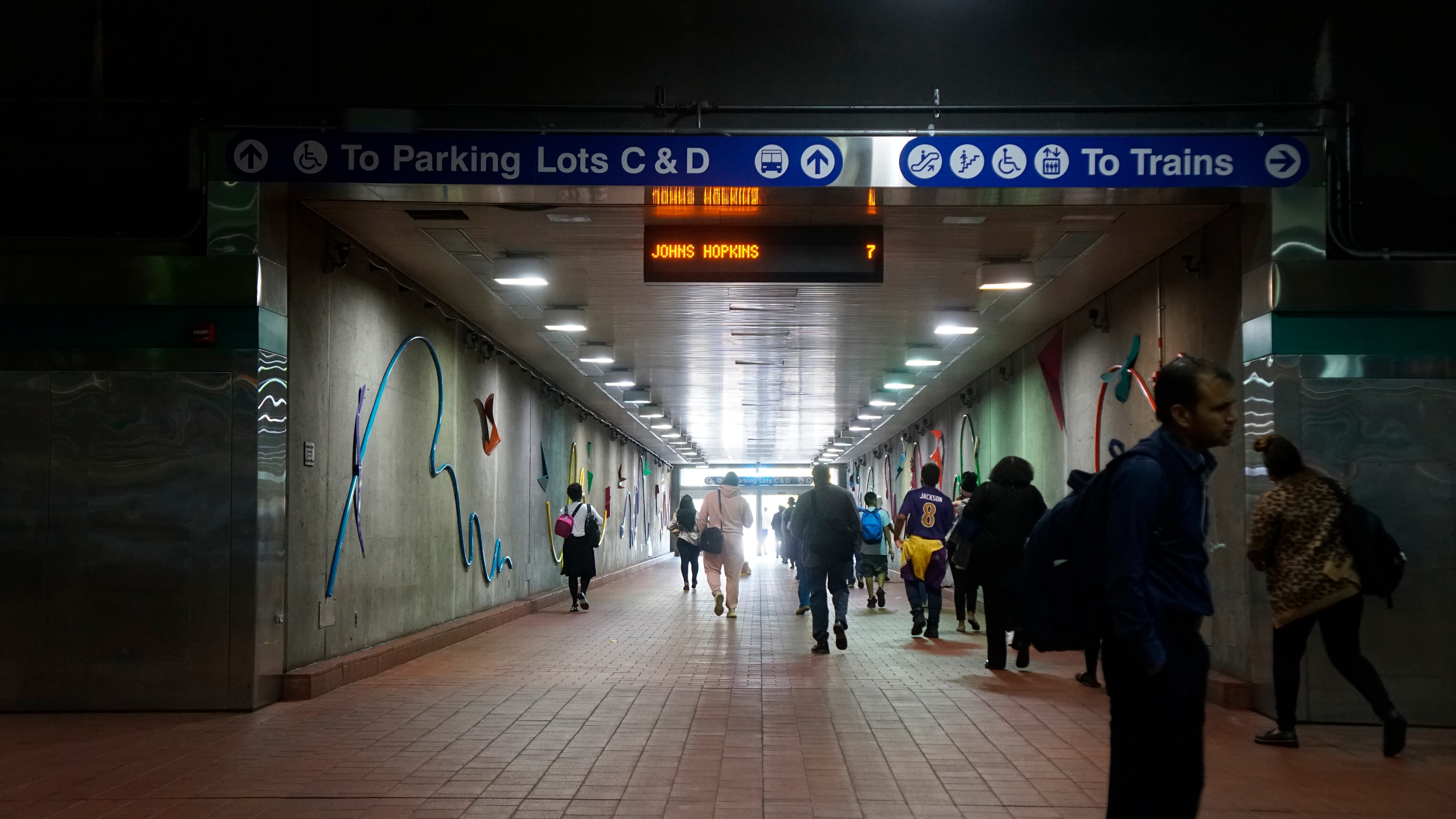 Commuters head for the exit at the Baltimore area Metro SubwayLink's northernmost Owings Mills stop on Sept. 20, 2023.
