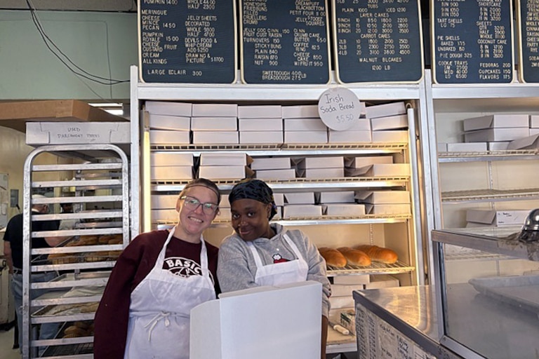 Sara Reprogel, left, and Simone Shaw, right, box up treats at Fenwick Bakery in Parkville. The two add up orders by hand, but thankfully they do take charge cards.