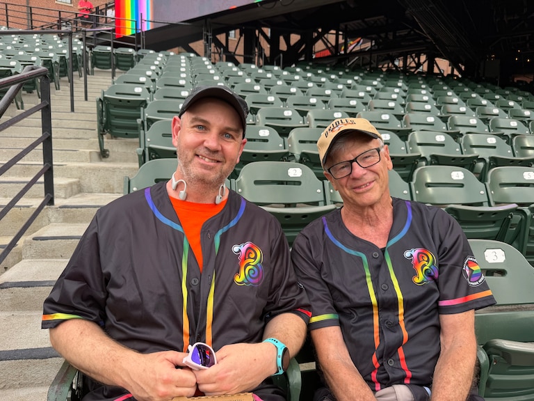 Patrick Locklin, left, and Carl Reed were at the game with their running club, the Baltimore Frontrunners.