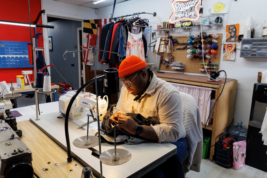 Thursday, Feb. 12, 2026, in Baltimore , MD— Aaron Jones tailors a clients jeans at his shop, Bushelers of Baltimore, in Mount Vernon.