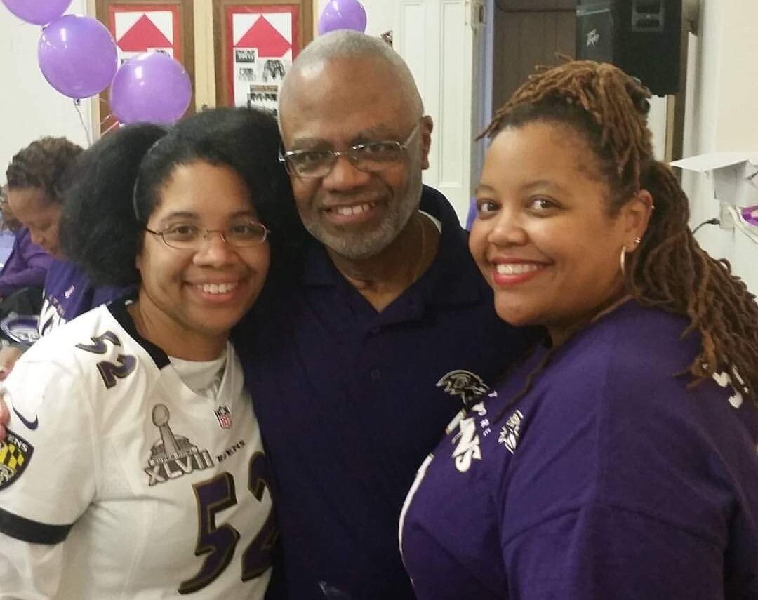 Reverend Grady A. Yeargin with his daughters Adia, left, and Candace, during the Ravens-themed party that City Temple of Baltimore (Baptist) church threw in 2015 for his 65th birthday.