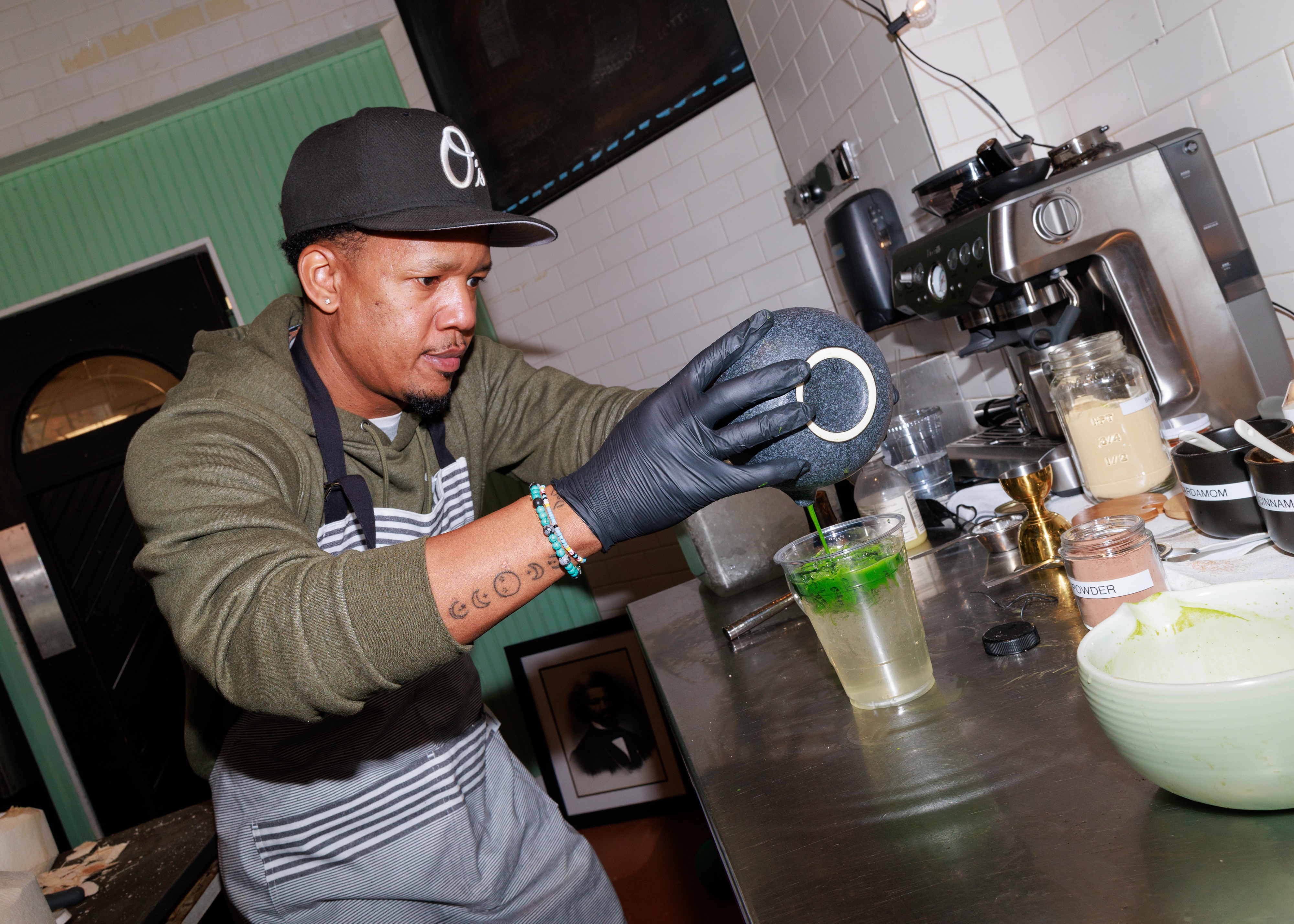 Equitea owner Quentin Vennie makes a matcha drink during the opening party for his pop-up shop in Remington earlier this year.