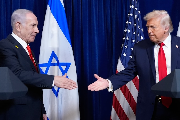 President Donald Trump shakes hands with Israel's Prime Minister Benjamin Netanyahu at the end of a news conference at Mar-a-Lago, Dec. 29, 2025, in Palm Beach, Fla.