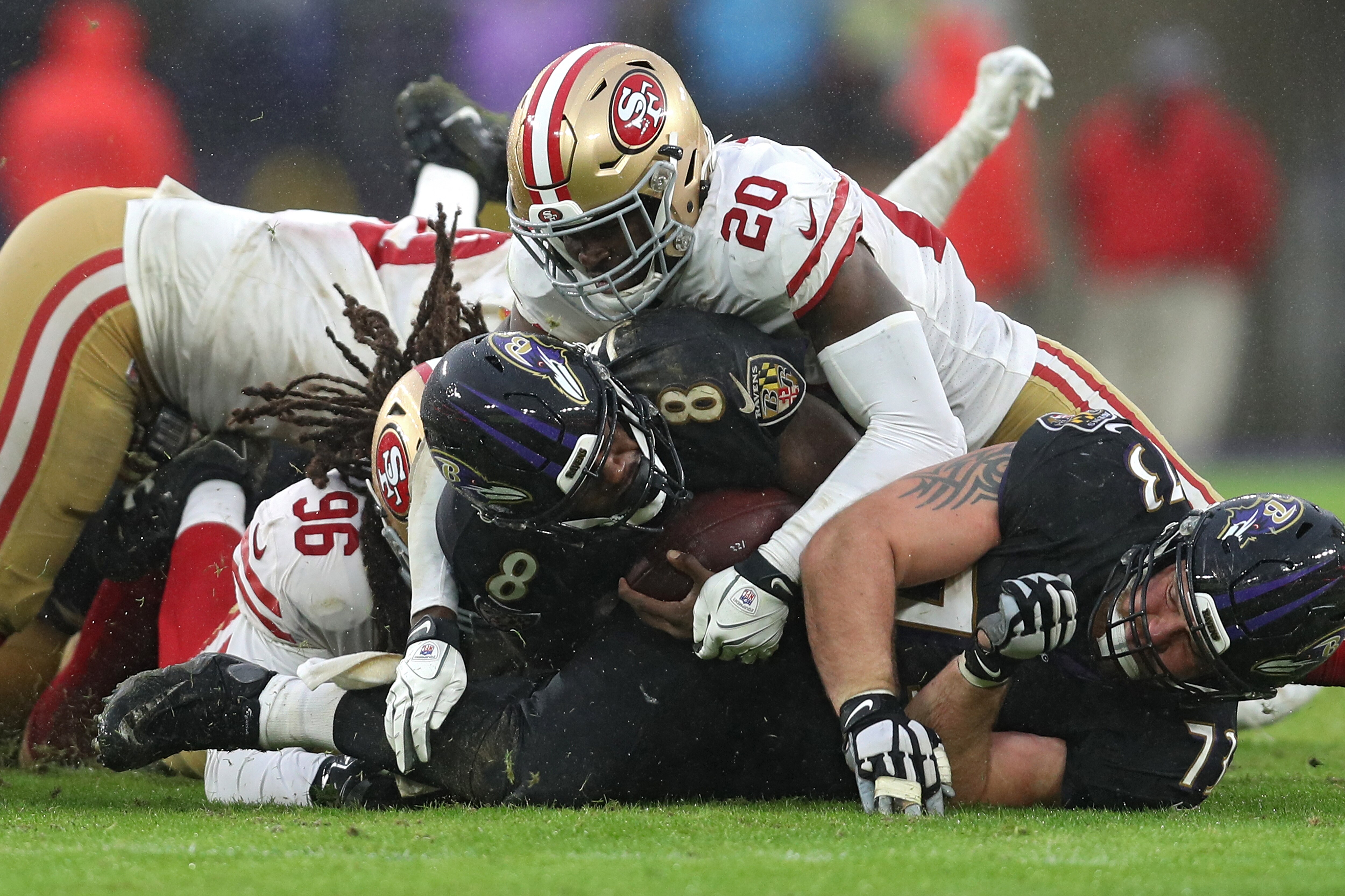 Quarterback Lamar Jackson picks up a rushing first down the last time the Ravens played the 49ers, in 2019. The teams will play again Monday in a likely ratings winner.