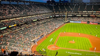 The Texas Rangers’ dugout is decorated with a rainbow as the Baltimore Orioles play the Texas Rangers at Orioles Park at Camden Yards in Baltimore during Pride Night on Wednesday, June 25, 2025.
