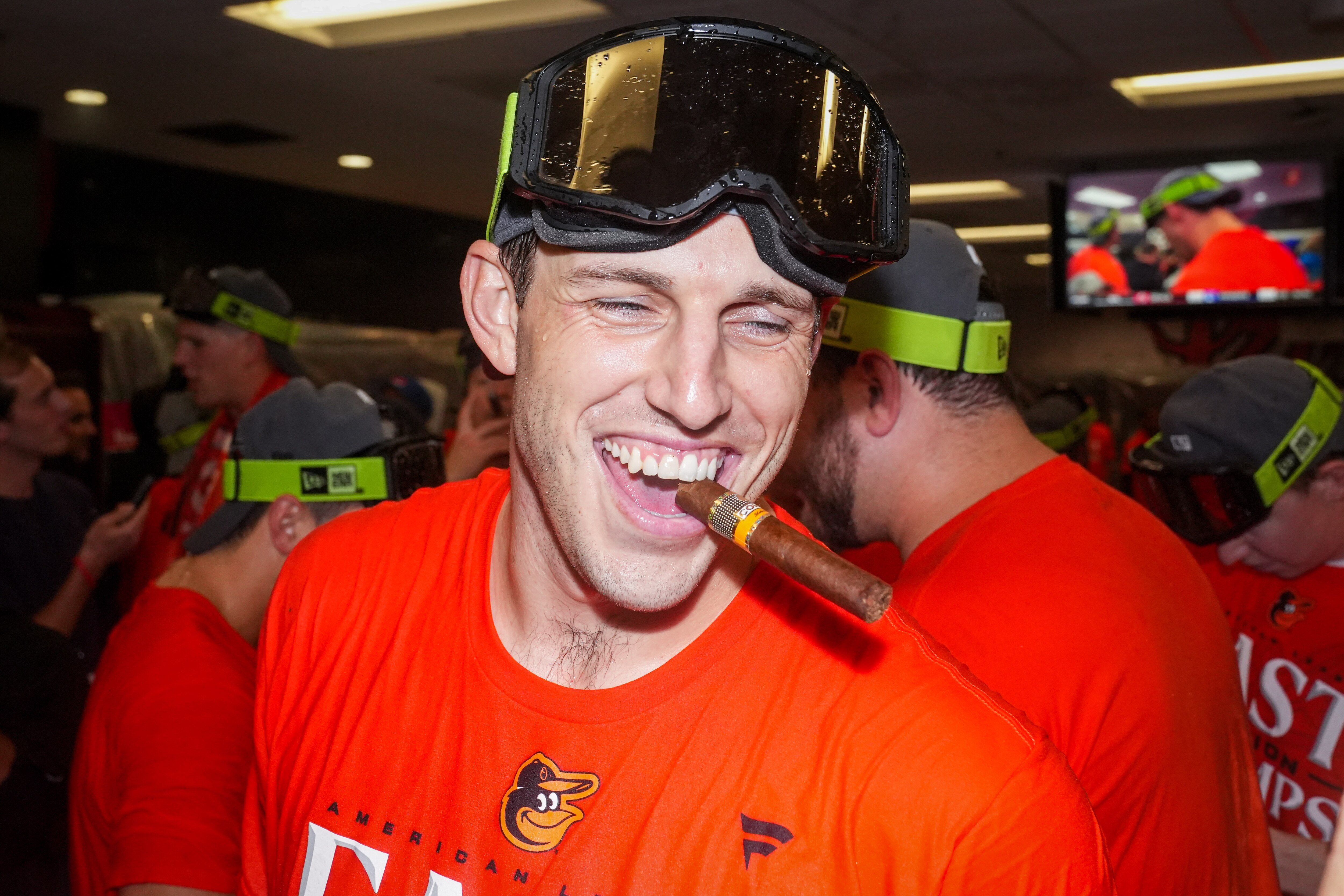 Orioles pitcher John Means celebrates with teammates in the locker room after they clinched the AL East last month.