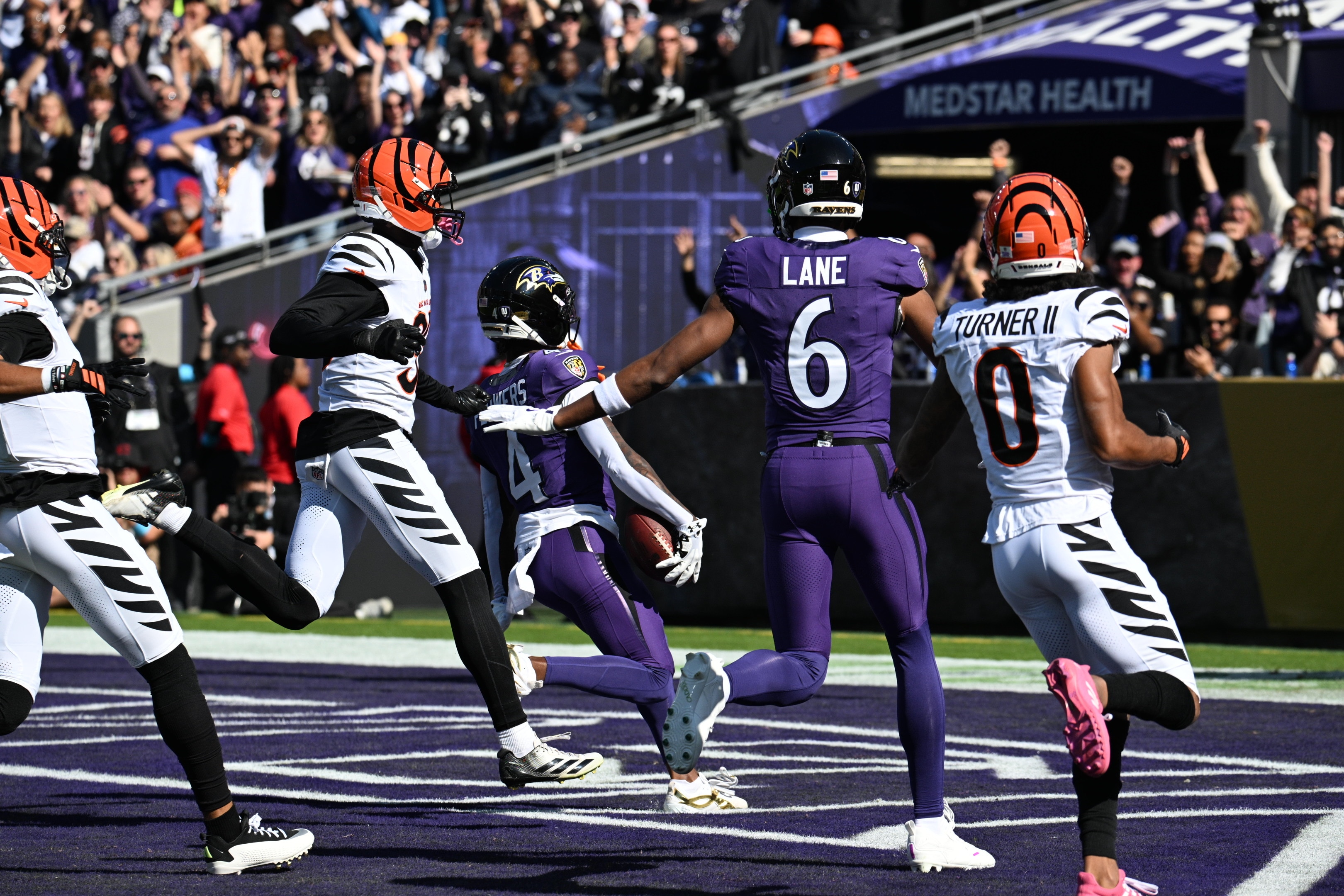 Ravens wide receiver Zay Flowers scores a touchdown in the first quarter of a game against the Bengals.