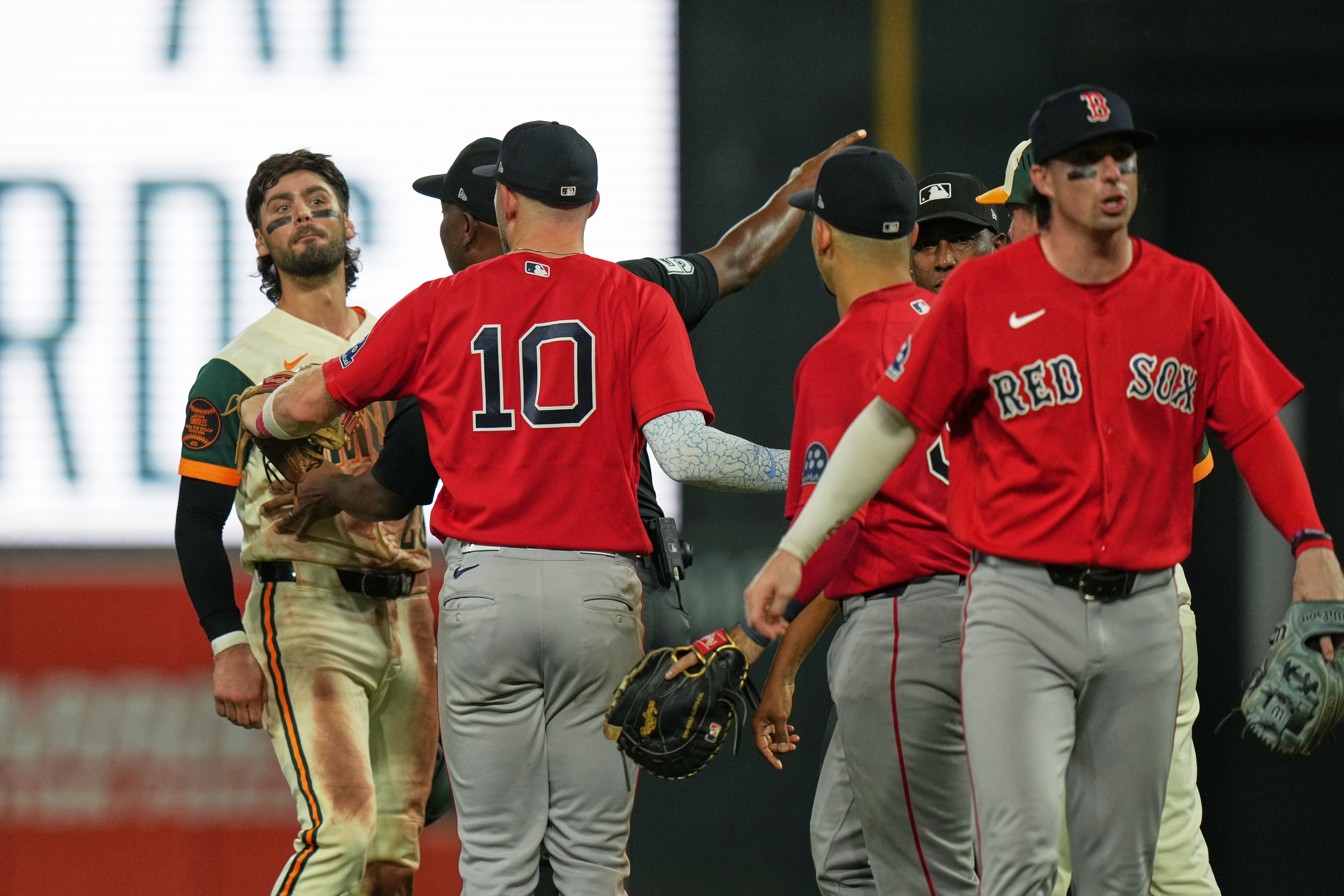 Baltimore Orioles' Blaze Alexander, left, yells at Boston Red Sox second baseman Nick Sogard, right, as benches clear during the eighth inning of a baseball game, Friday, Sept. 4, 2026, in Baltimore. (AP Photo/Stephanie Scarbrough)