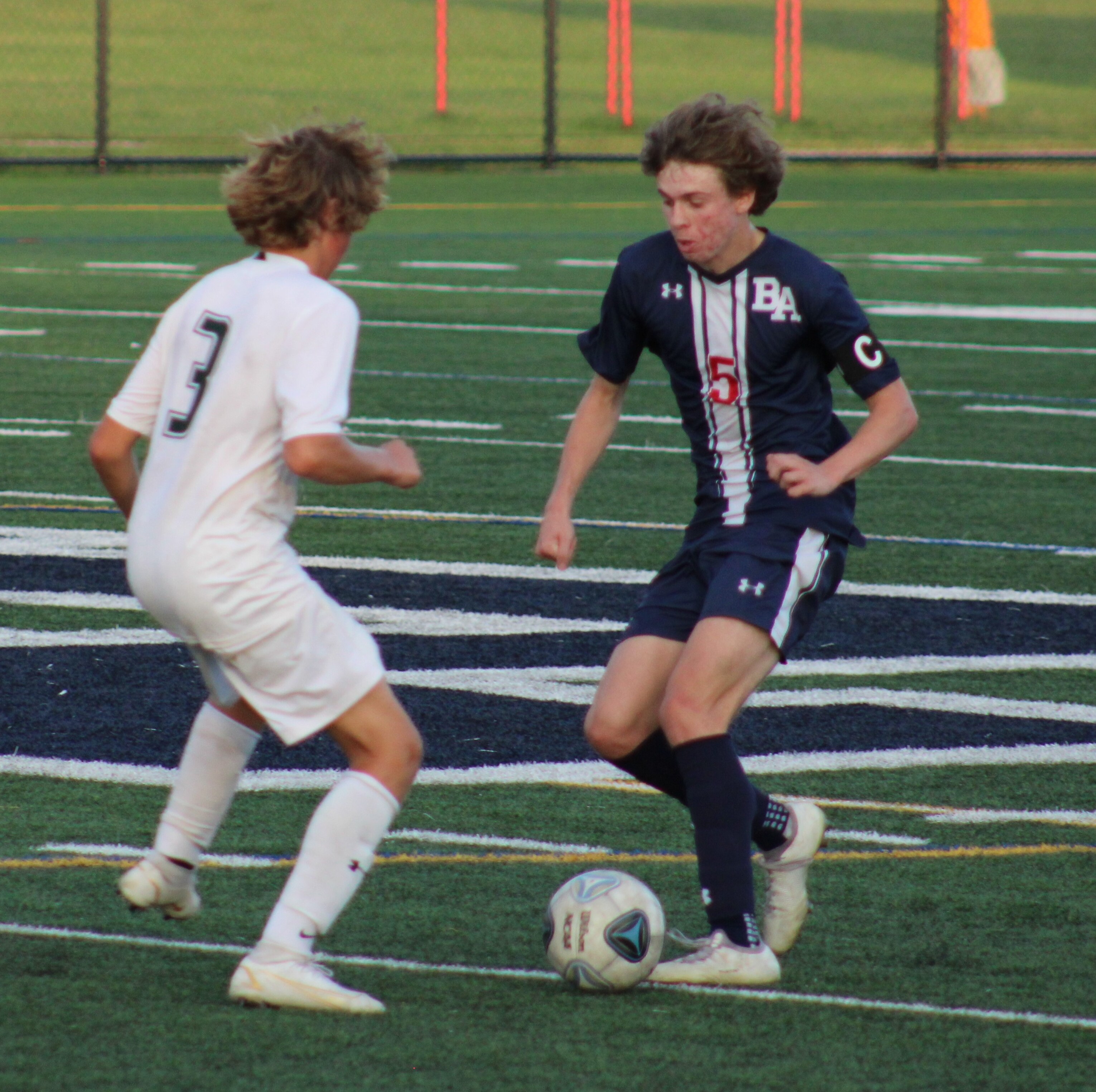 Bel Air's Matt Weidman (right) tries to get past North Harford's Cole Schultz during Tuesday's UCBAC Chesapeake boys soccer game. Weidman was responsible for the Bobcats' offense with a goal and an assist in a 2-1 victory over the 15th-ranked Hawks in Harford County.