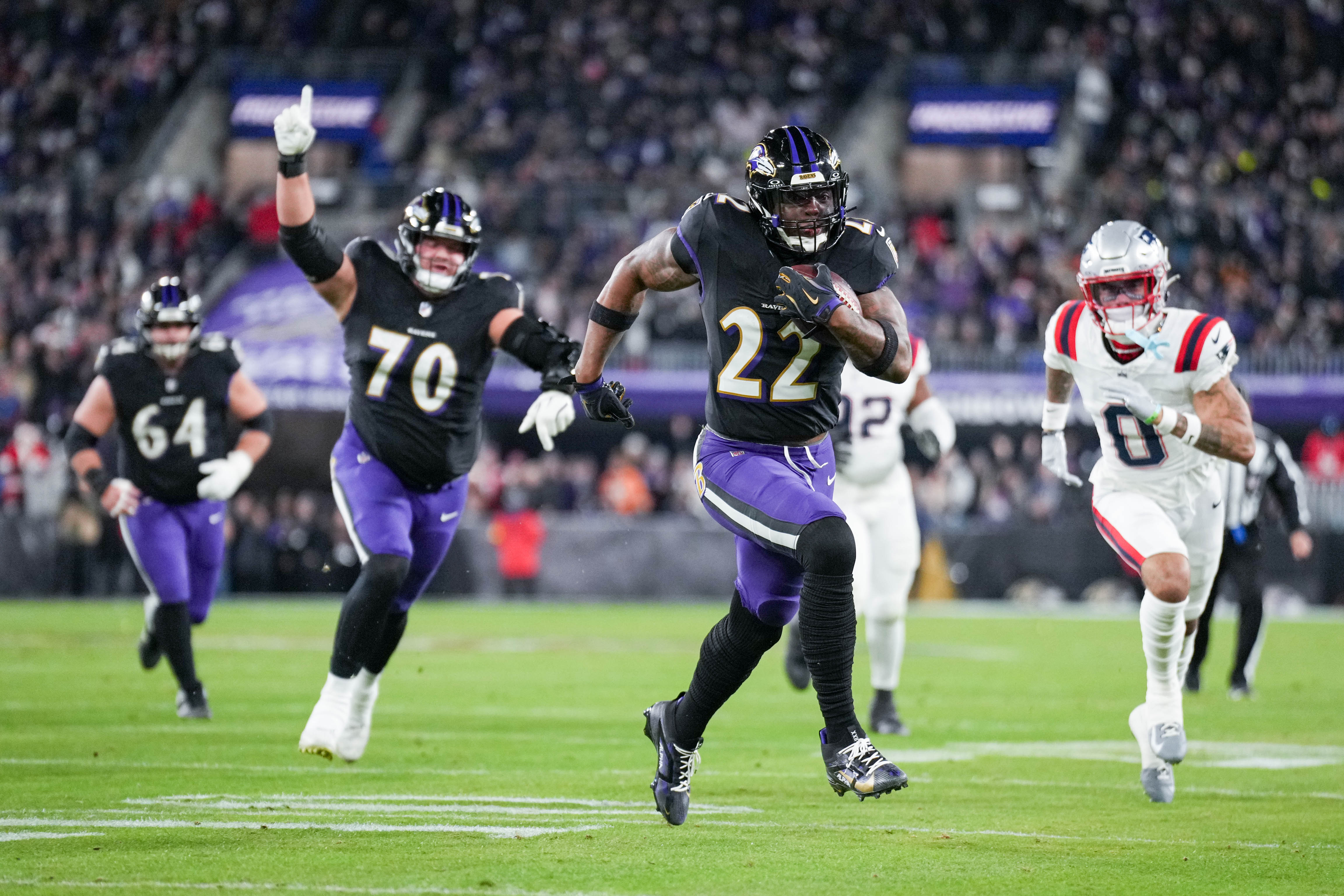 Running back Derrick Henry scores the first of his two touchdowns Sunday night in the Ravens’ 28-24 loss to the Patriots.