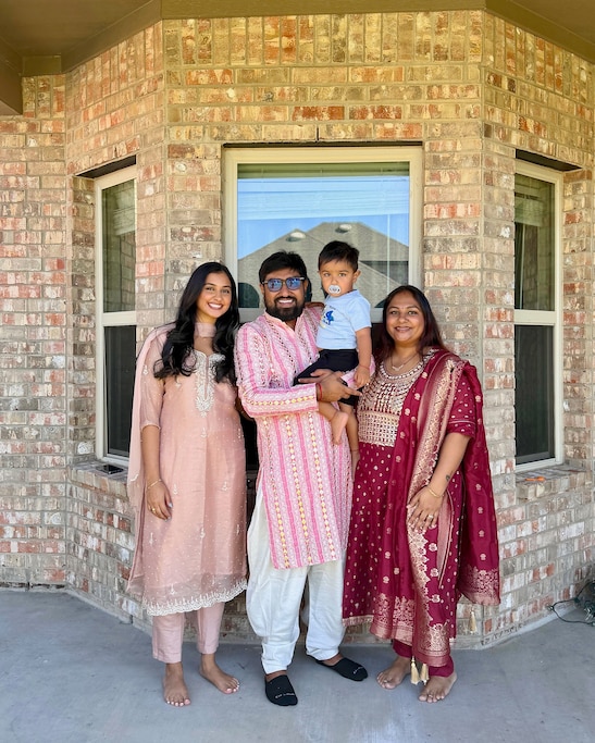 Anjali Sharma, left, with her cousin's family, who were rerouted to Cairo when the war started.