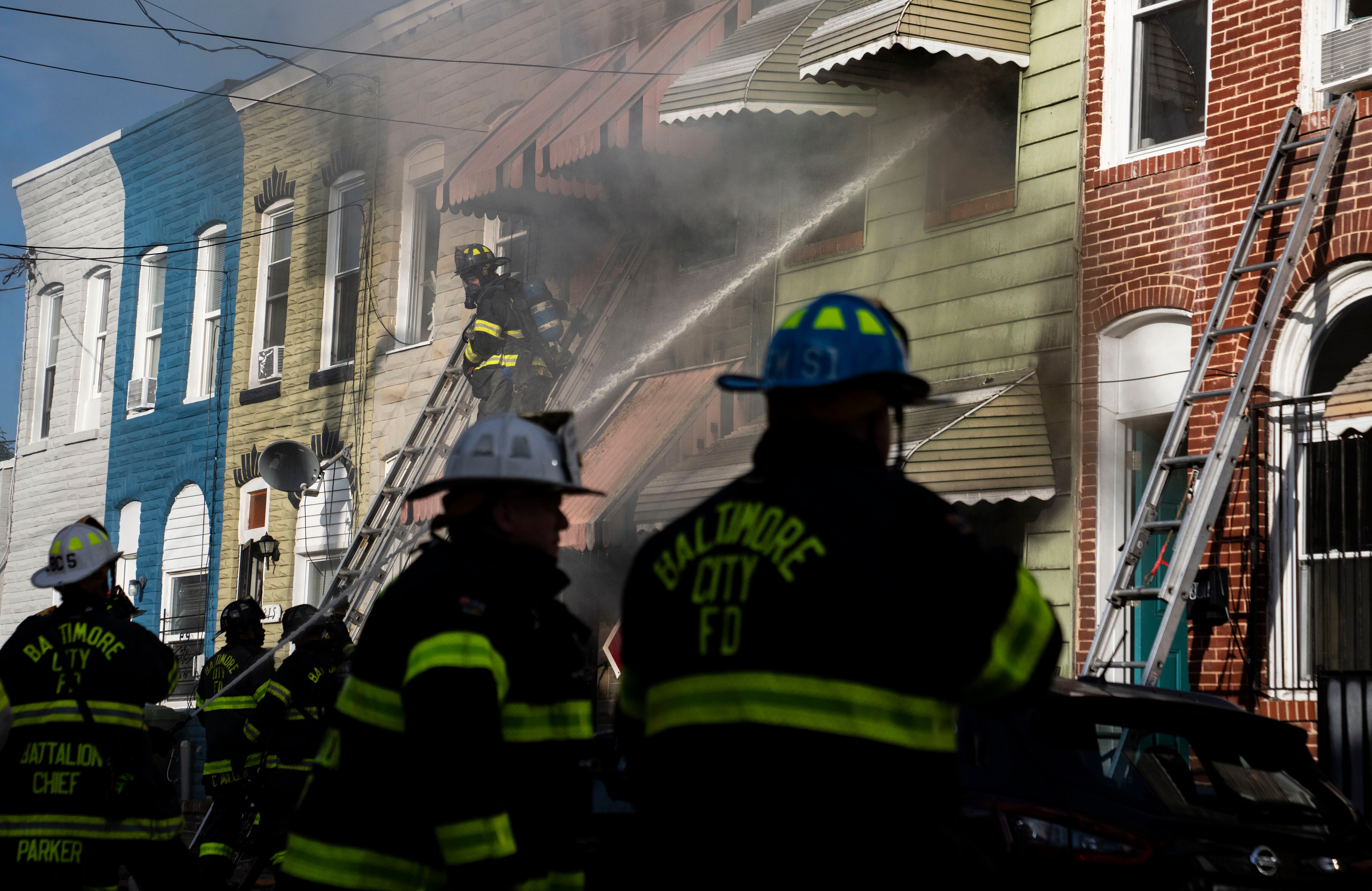 Baltimore City Fire attempt to put out a fire on Loneys Lane near the Pulaski Highway on Monday.