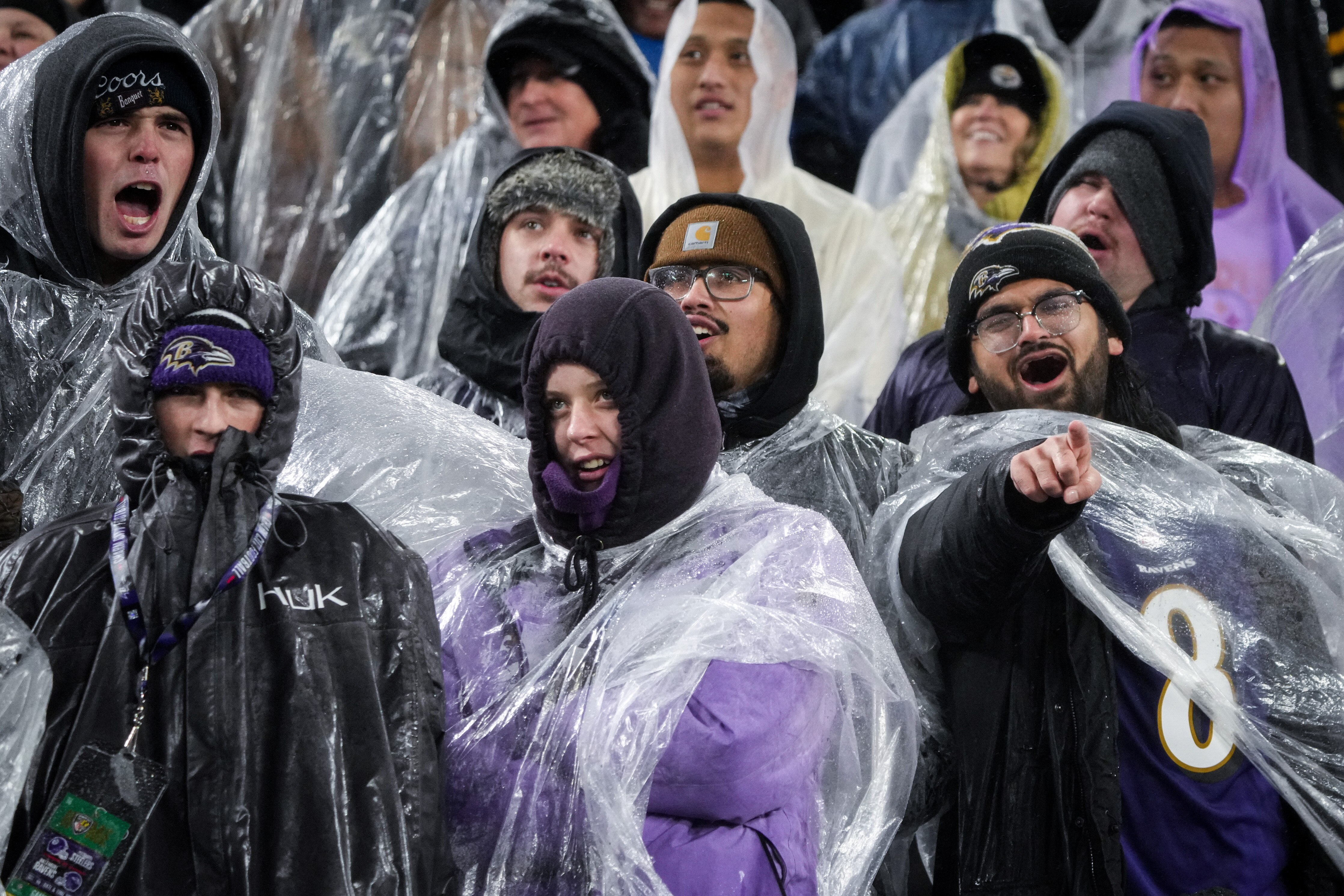 Ravens fans cheer from the stands despite the bad weather during Saturday's game. Give them all A's.