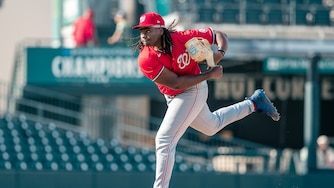 Washington Nationals pitching prospect Miguel Sime Jr. pitches during a spring training game against the St. Louis Cardinals on March 19.