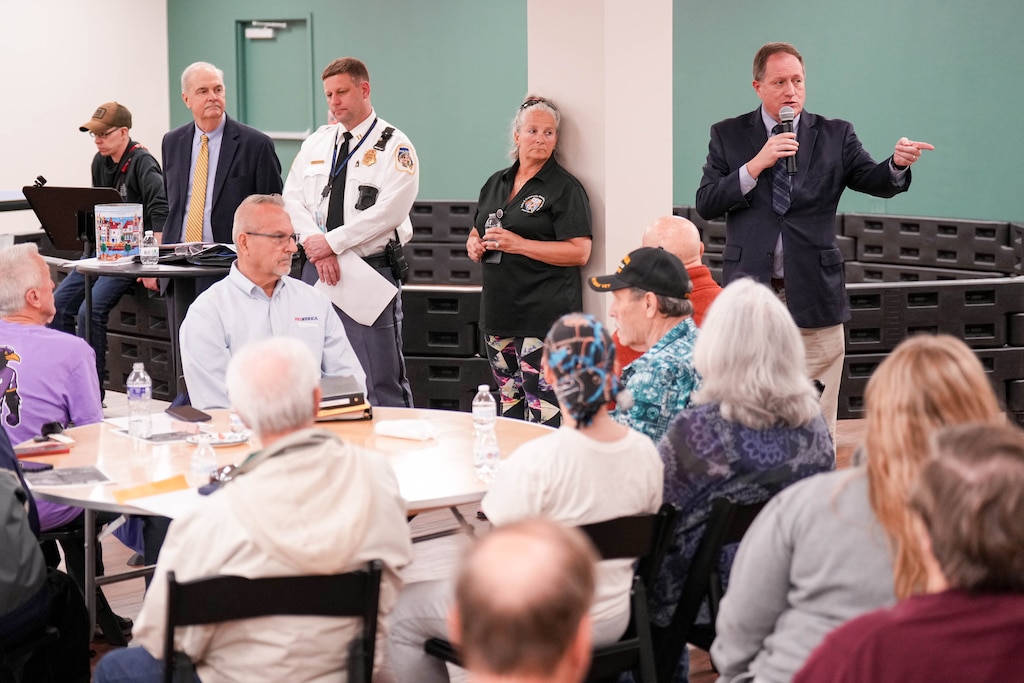 Baltimore County Councilman David Marks, right, gives remarks during a meeting of the White Marsh Police and Community Relations Council at the Perry Hall Family Worship Center in Perry Hall, Md., on Tuesday, March 10, 2026.