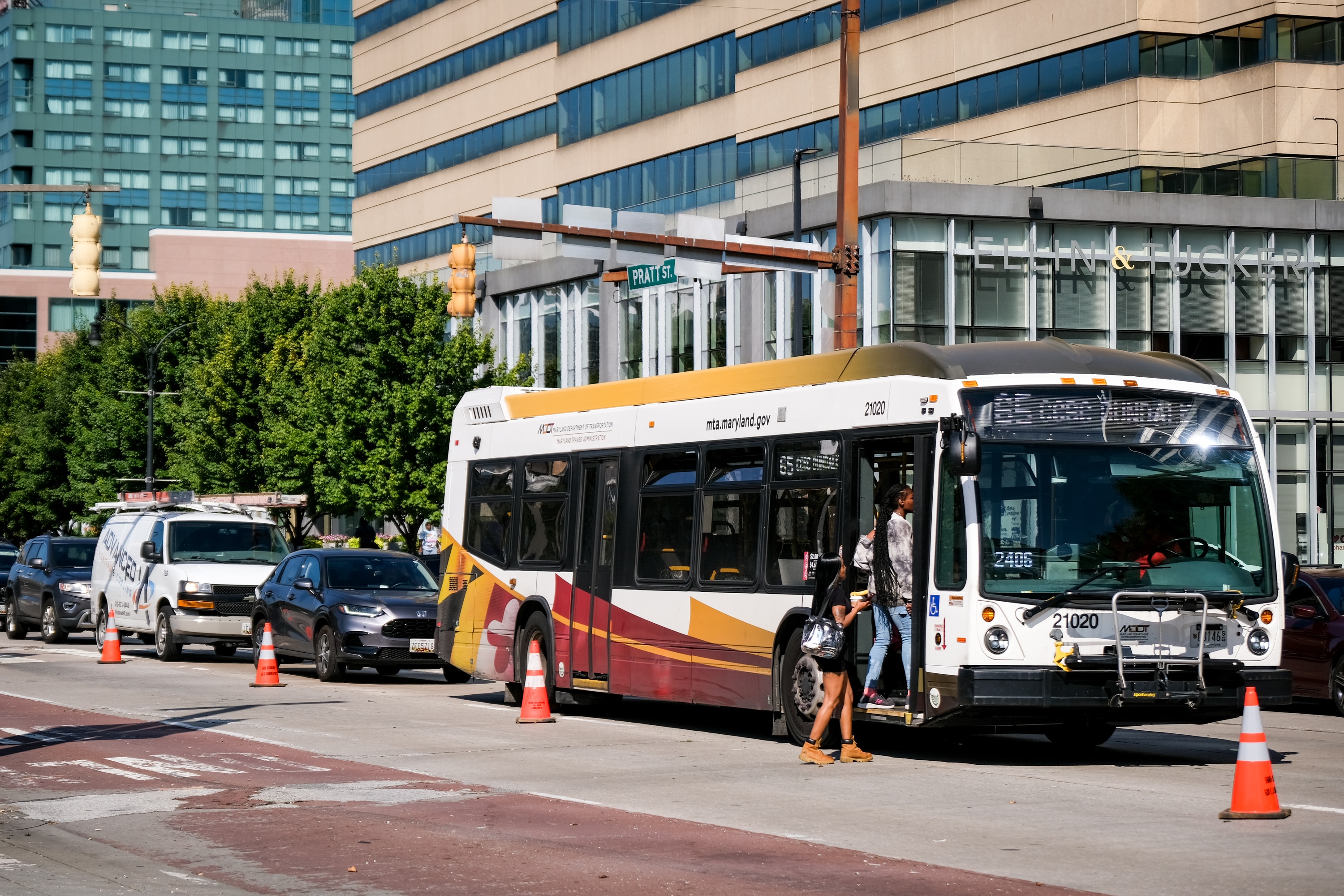 People board an MTA bus in downtown Baltimore in September.
