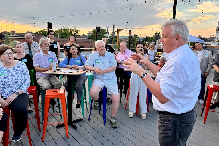 David Trone, a former congressman running for his old seat in the 6th District, speaks with guests at his campaign event on Monday in Frederick.