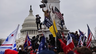 WASHINGTON, DC - JANUARY 06: Trump supporters gather outside the U.S. Capitol building following a "Stop the Steal" rally on January 06, 2021 in Washington, DC. A pro-Trump mob stormed the Capitol earlier, breaking windows and clashing with police officers. Trump supporters gathered in the nation's capital to protest the ratification of President-elect Joe Biden's Electoral College victory over President Donald Trump in the 2020 election.