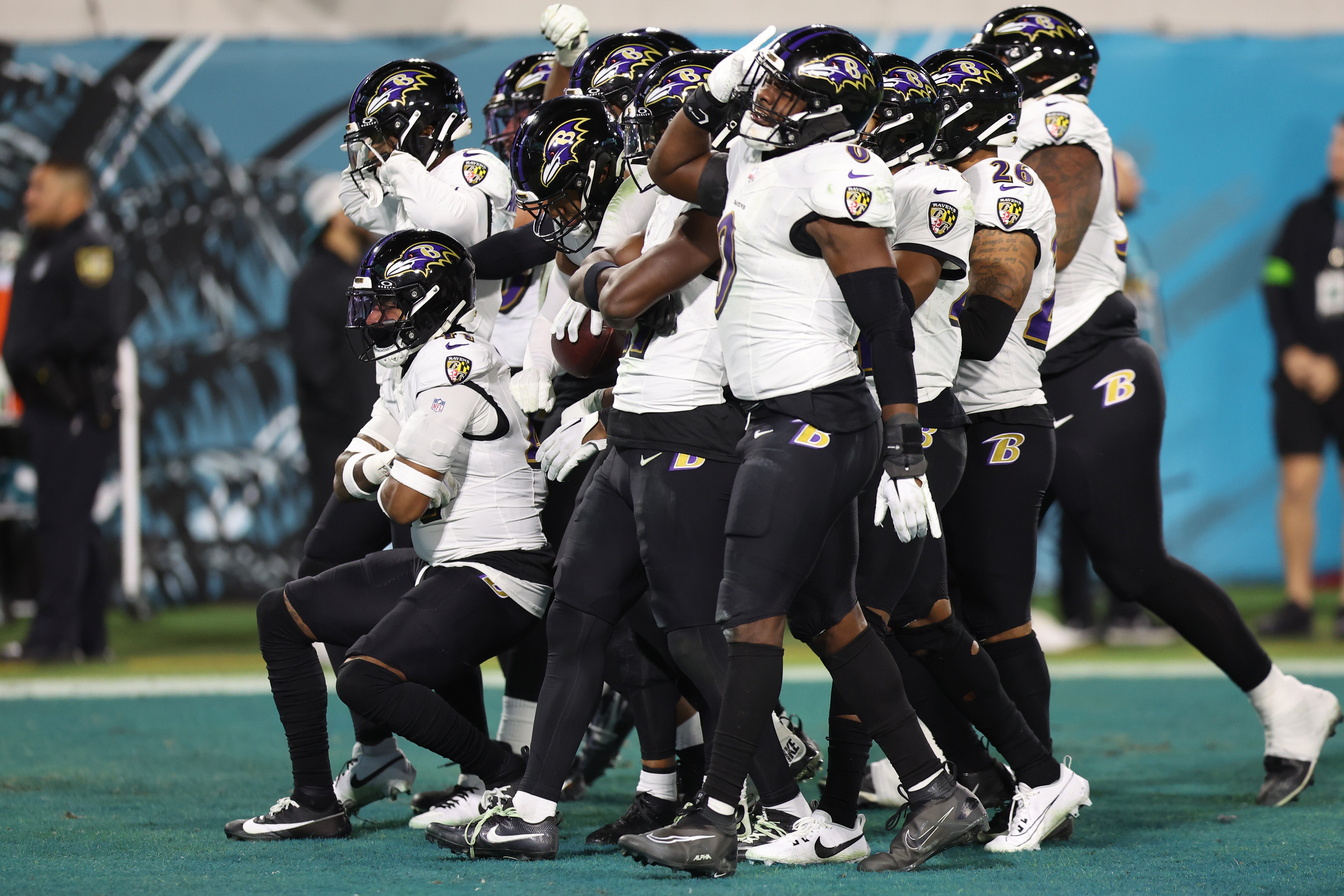 The Ravens' defense celebrates a fourth-quarter turnover during Sunday night's 23-7 win at Jacksonville.