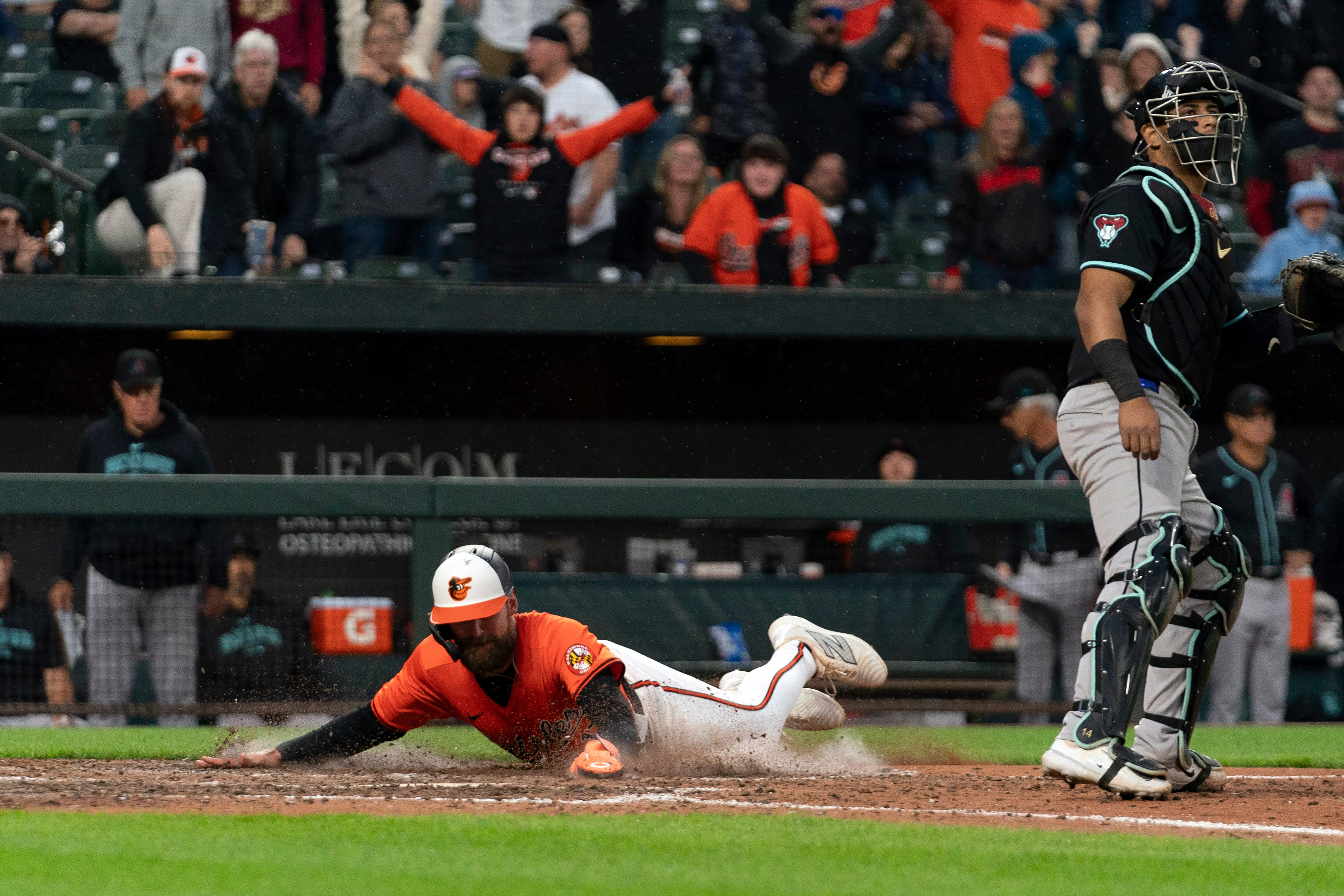 Orioles outfielder Colton Cowser scores the winning run on a hit by Jordan Westburg in the 11th inning Saturday at Camden Yards.