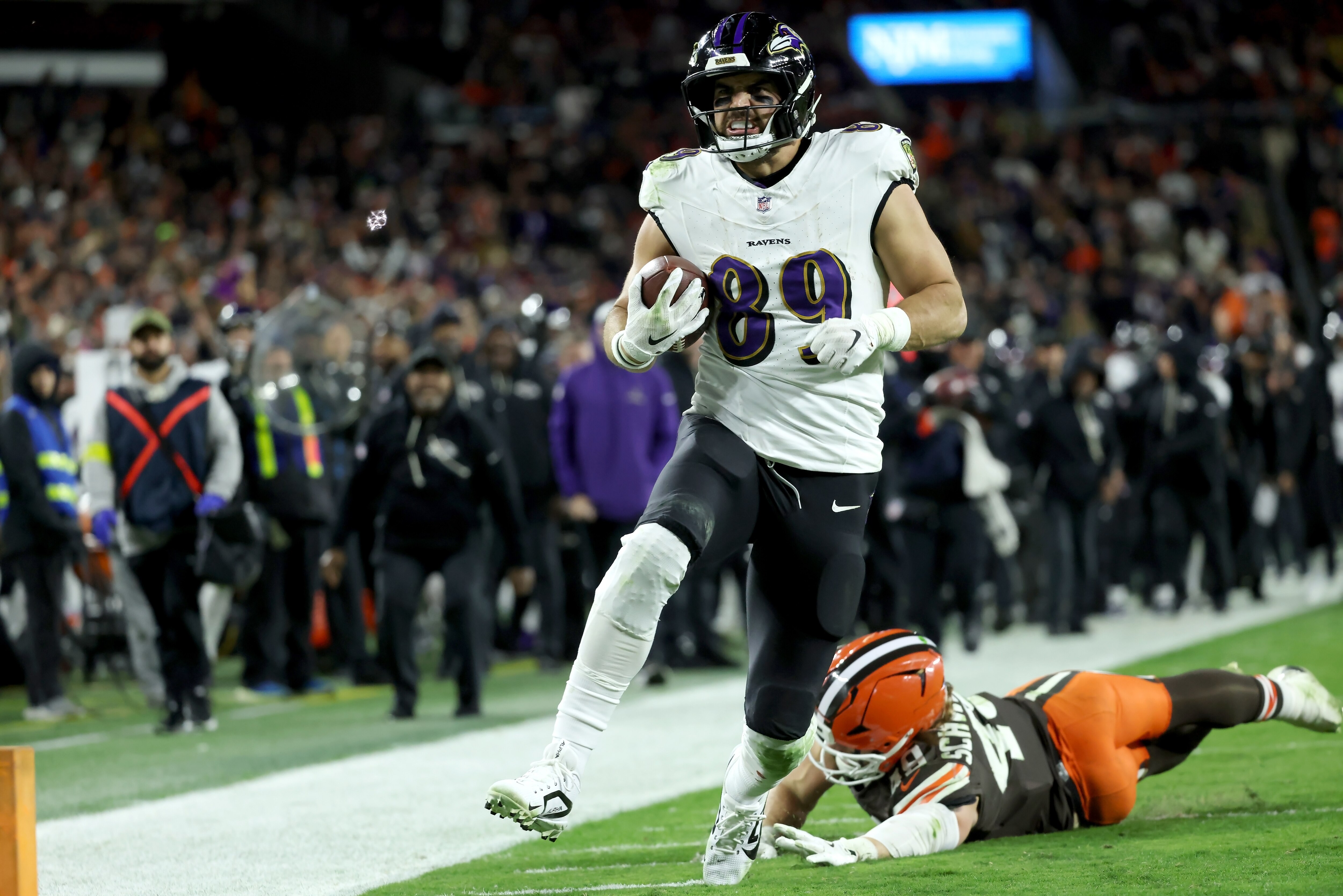 Ravens tight end Mark Andrews outruns a diving attempted tackle by Browns linebacker Carson Schwesinger to score the winning touchdown Sunday in Cleveland.