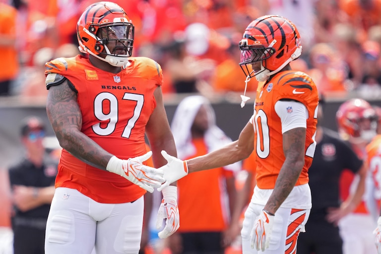 CINCINNATI, OHIO - SEPTEMBER 13: Dexter Lawrence #97 of the Cincinnati Bengals celebrates with teammate Tacario Davis #20 during an NFL game against the Tampa Bay Buccaneers at Paycor Stadium on September 13, 2026 in Cincinnati, Ohio. (Photo by Jeff Dean/Getty Images)