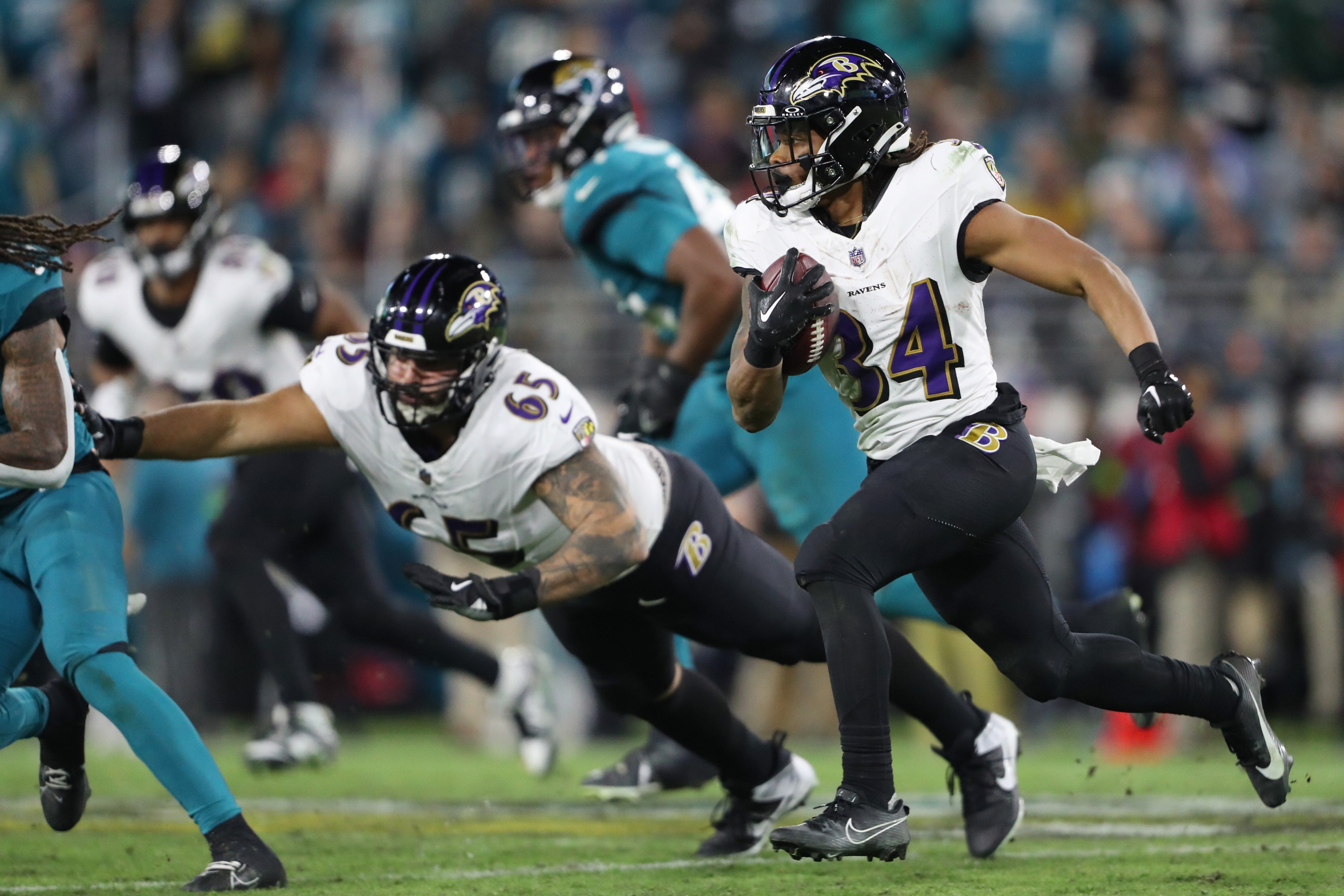 Keaton Mitchell, #34 of the Baltimore Ravens, runs with the ball against the Jacksonville Jaguars during the third quarter at EverBank Stadium on Dec. 17, 2023 in Jacksonville, Florida. (Photo by Courtney Culbreath/Getty Images)