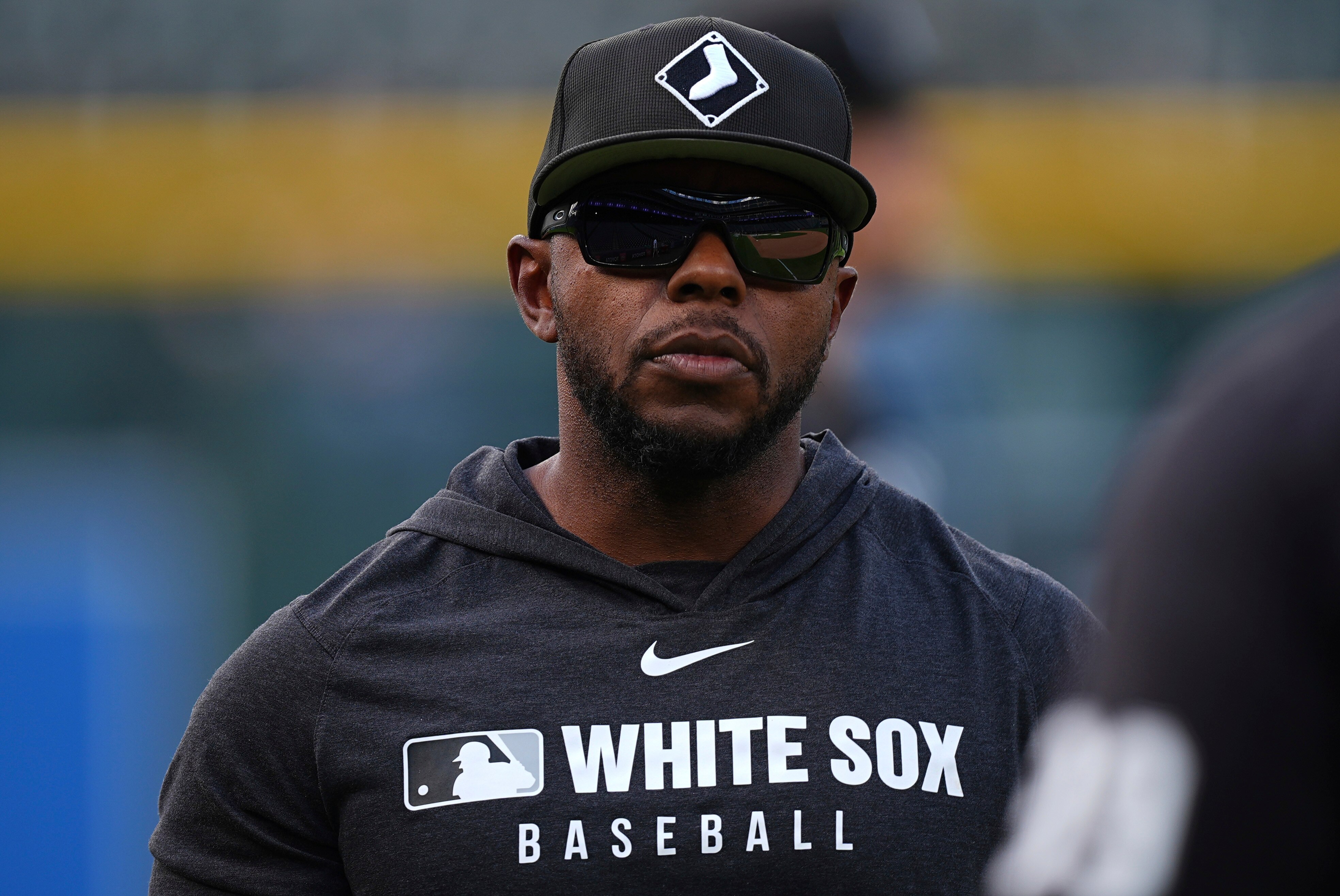 Chicago White Sox first base coach Jason Bourgeois looks on as players warm up before a game against the Colorado Rockies on July 4.