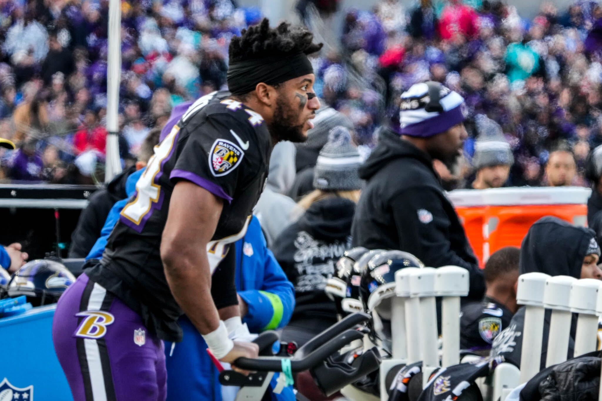 Ravens corner Marlon Humphrey rides a stationary bike after injury his calf in the first half of a game at M&T Bank Stadium against the Miami Dolphins on Dec. 31, 2024.