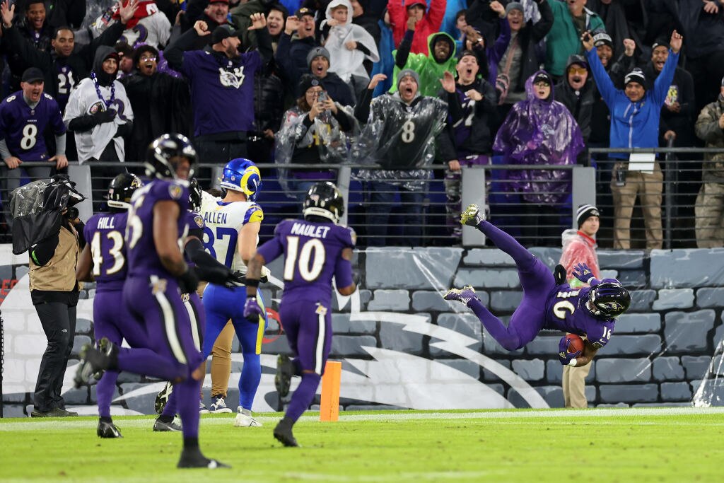Tylan Wallace #16 of the Baltimore Ravens returns a punt for a touchdown in overtime in the game against the Los Angeles Rams at M&T Bank Stadium on Dec. 10, 2023, in Baltimore.
