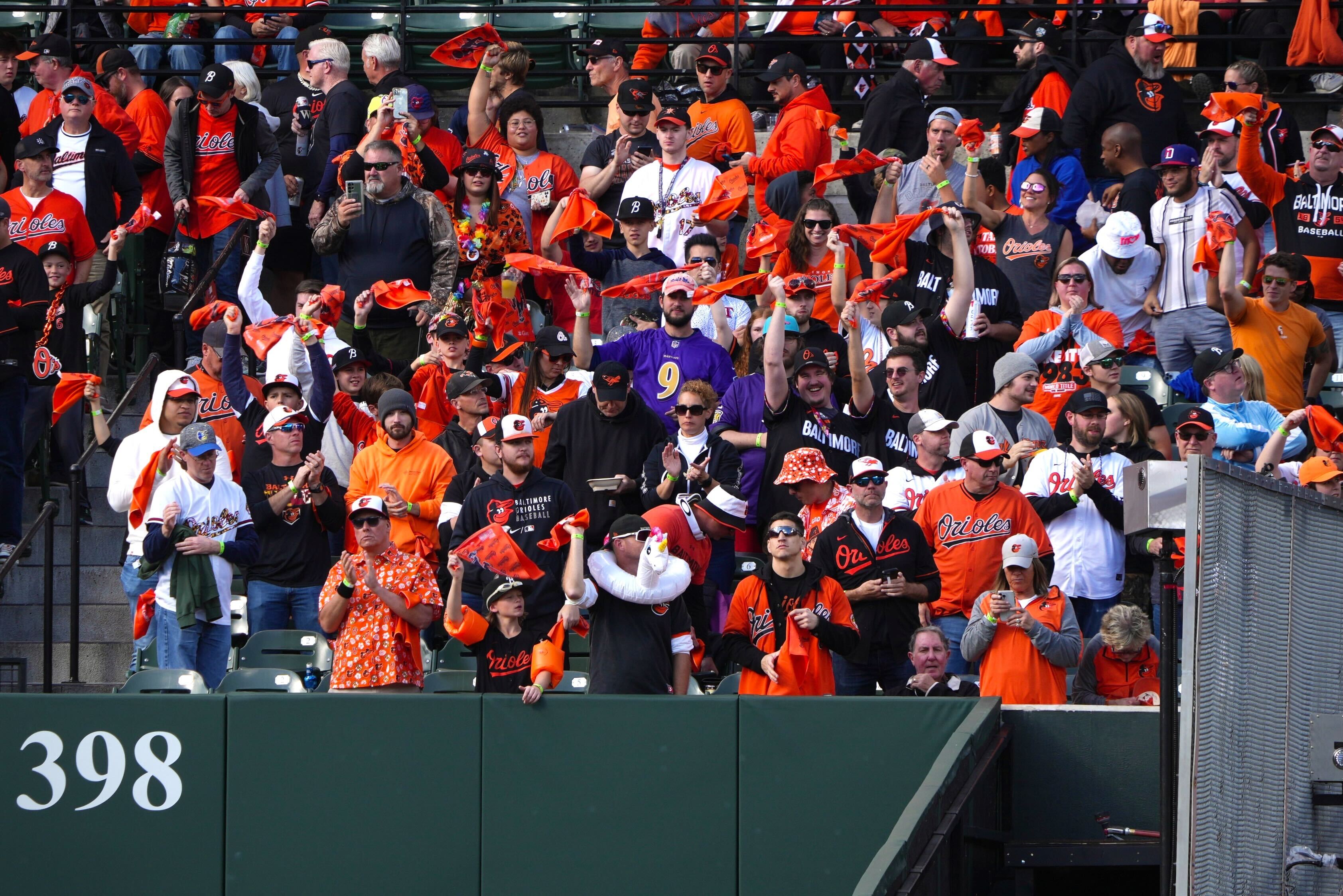 The crowd in Section 86, the Bird Bath, cheers as Orioles players are introduced.