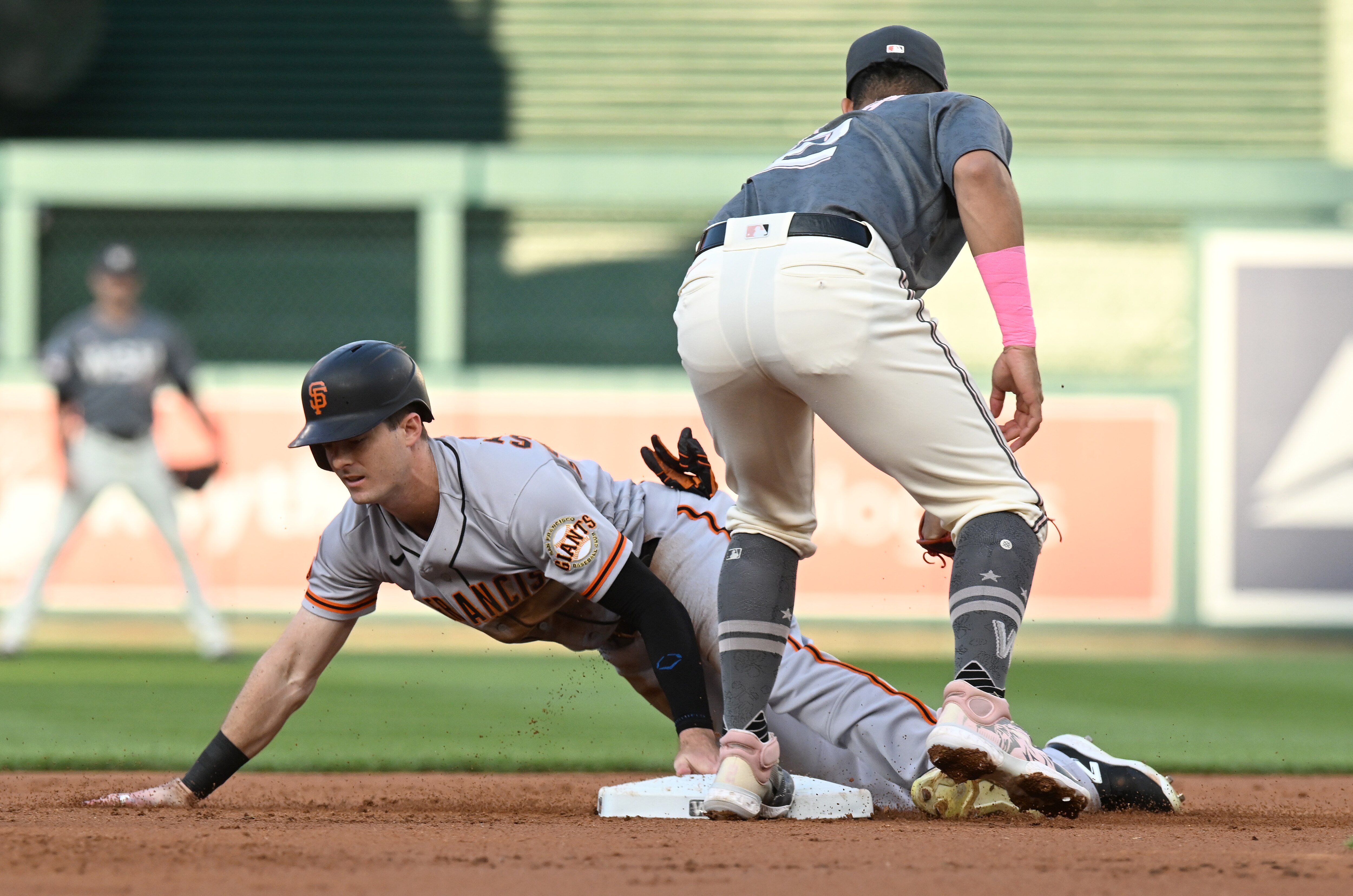 Mike Yastrzemski of the Giants steals second base in the second inning, beating the tag of Luis Garcia. The Nationals beat San Francisco 10-1.