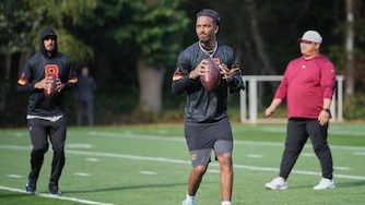 Washington Commanders quarterback Marcus Mariota, left, quarterback Jayden Daniels (5) work out during NFL football practice in London, Wednesday, Sept. 30, 2026, (AP Photo/Alastair Grant)